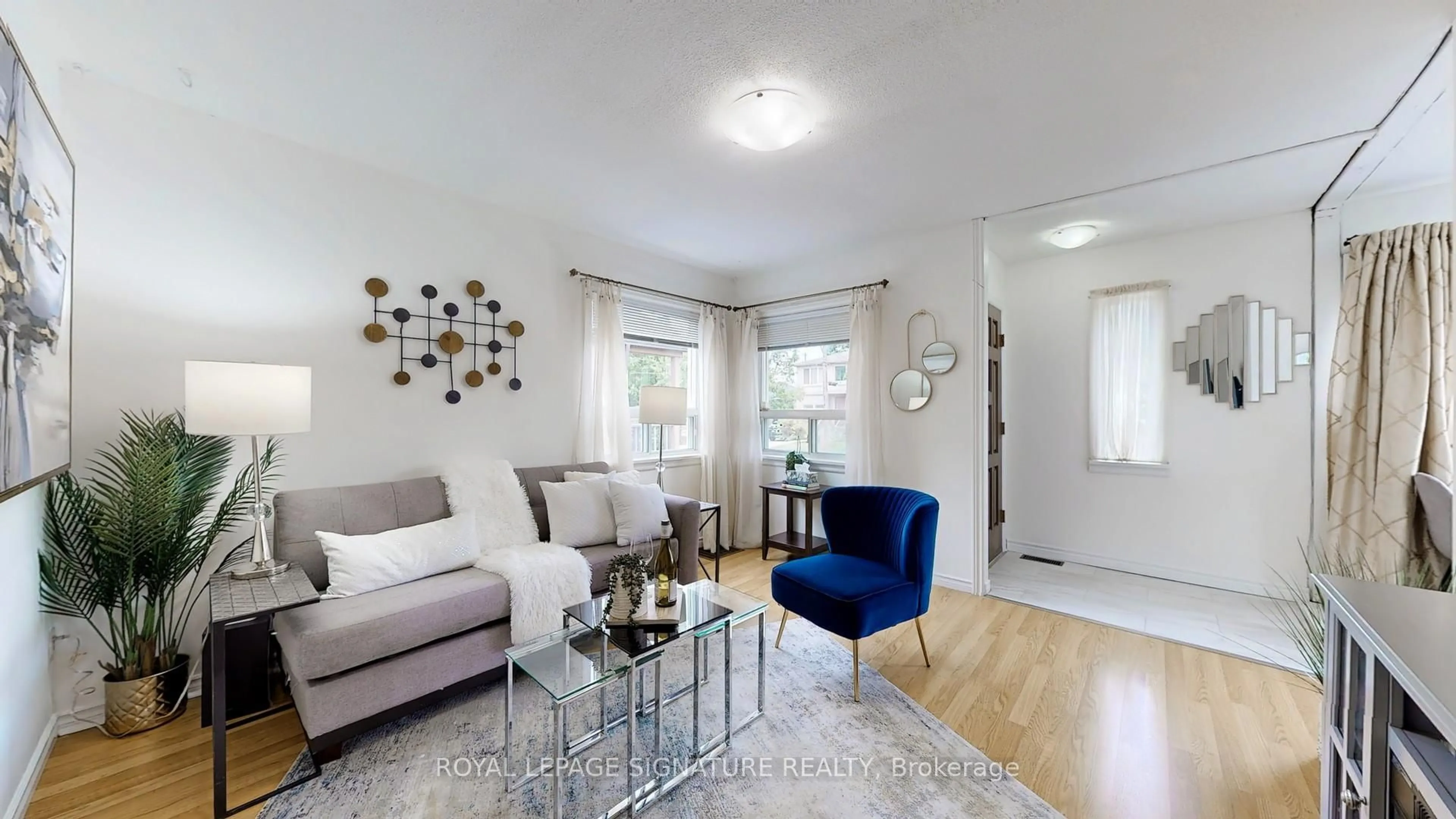 Living room with furniture, wood/laminate floor for 48 Acorn Ave, Toronto Ontario M9B 3P9