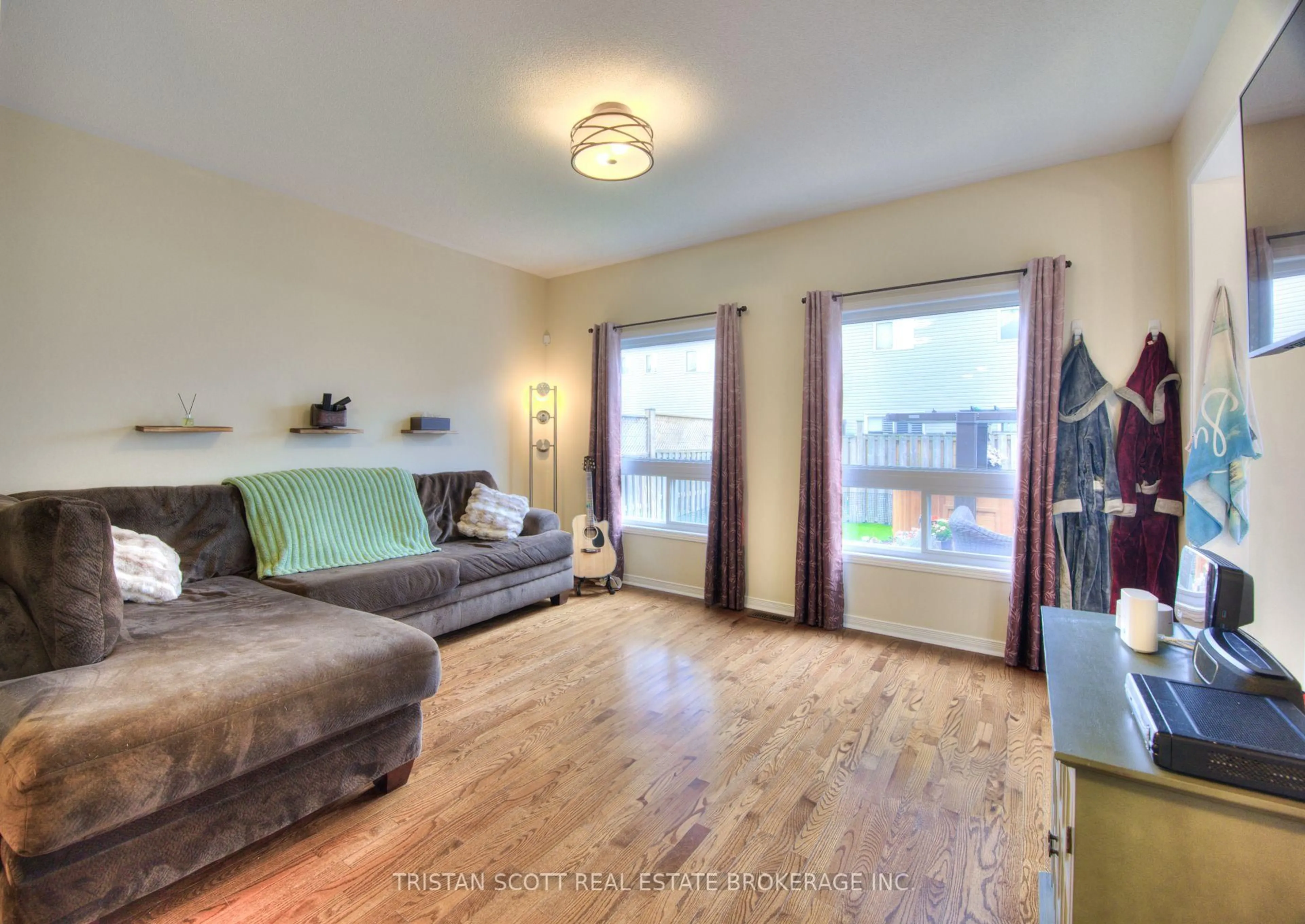 Living room with furniture, wood/laminate floor for 326 Racey Tr, Milton Ontario L9T 0B2