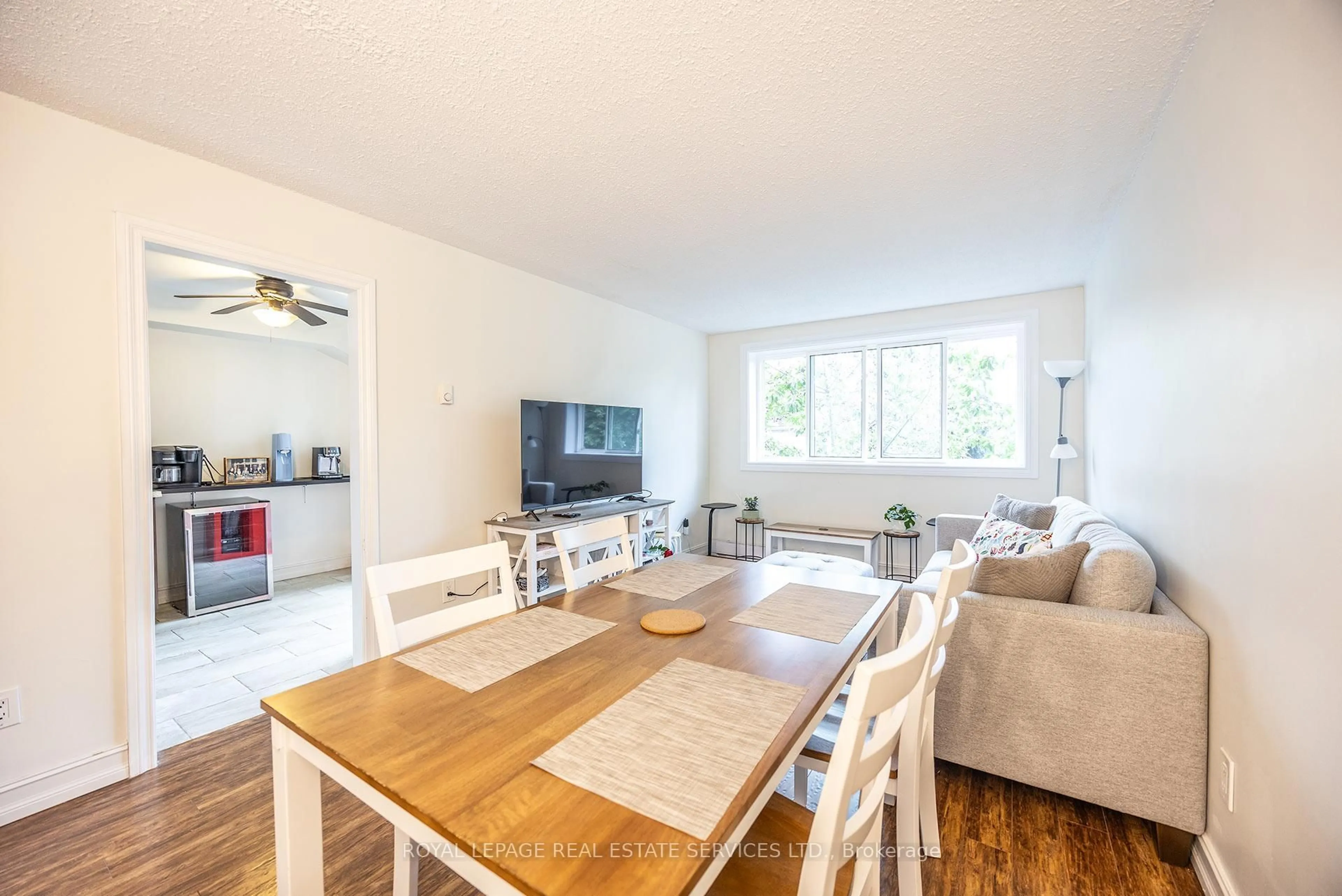 Living room with furniture, wood/laminate floor for 2170 Bromsgrove Rd #130, Mississauga Ontario L5J 4J2