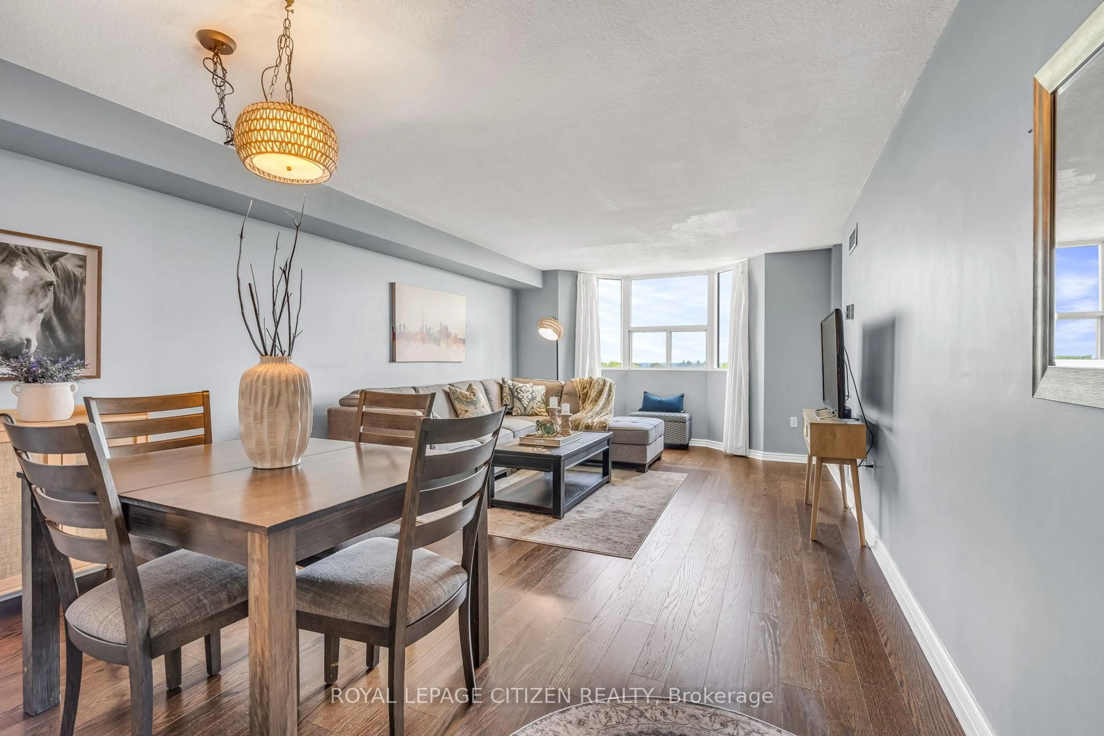 Living room with furniture, wood/laminate floor for 3845 Lake Shore Blvd #710, Toronto Ontario M8W 4Y3