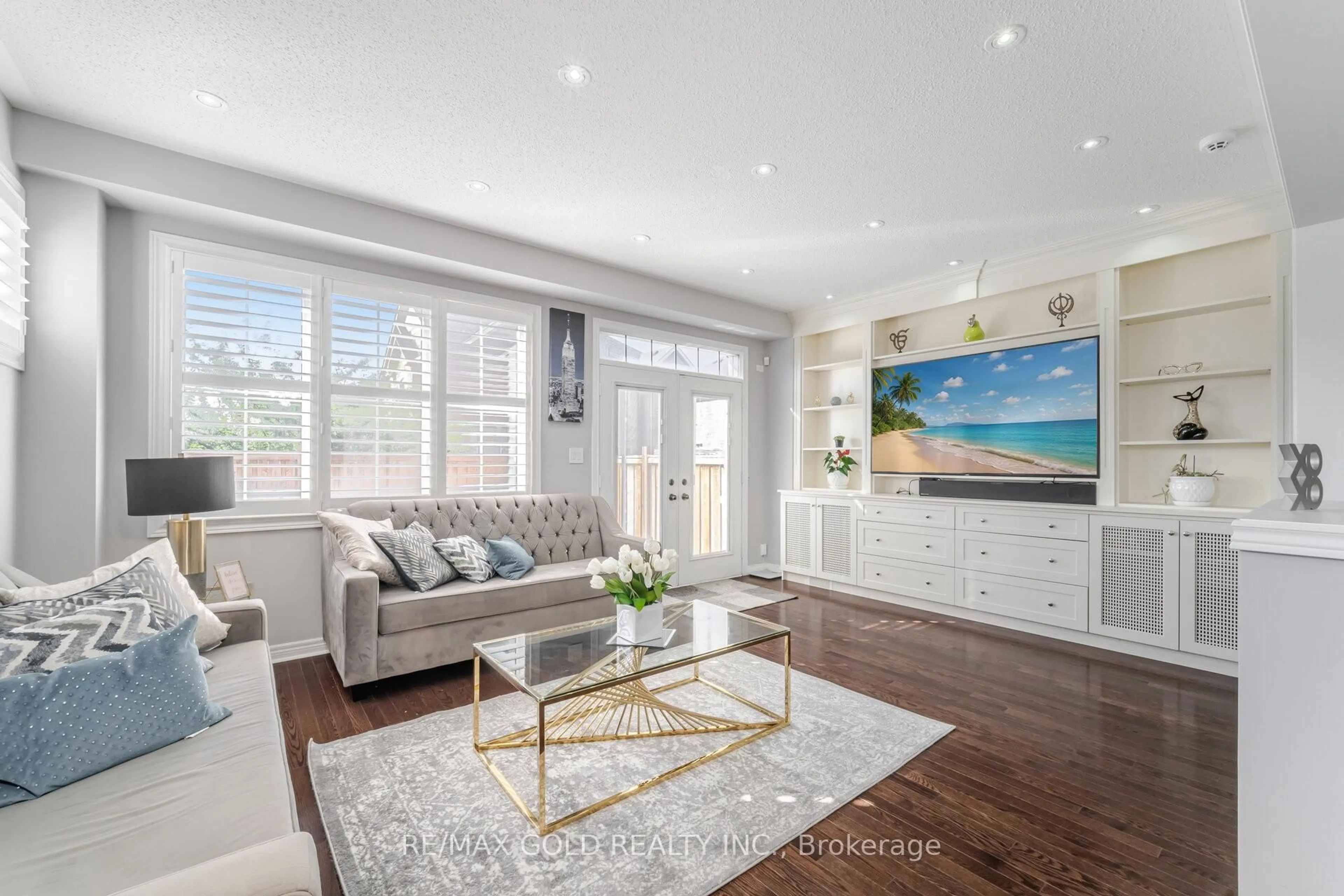 Living room with furniture, wood/laminate floor for 46 Lesabre Cres, Brampton Ontario L6P 3R4
