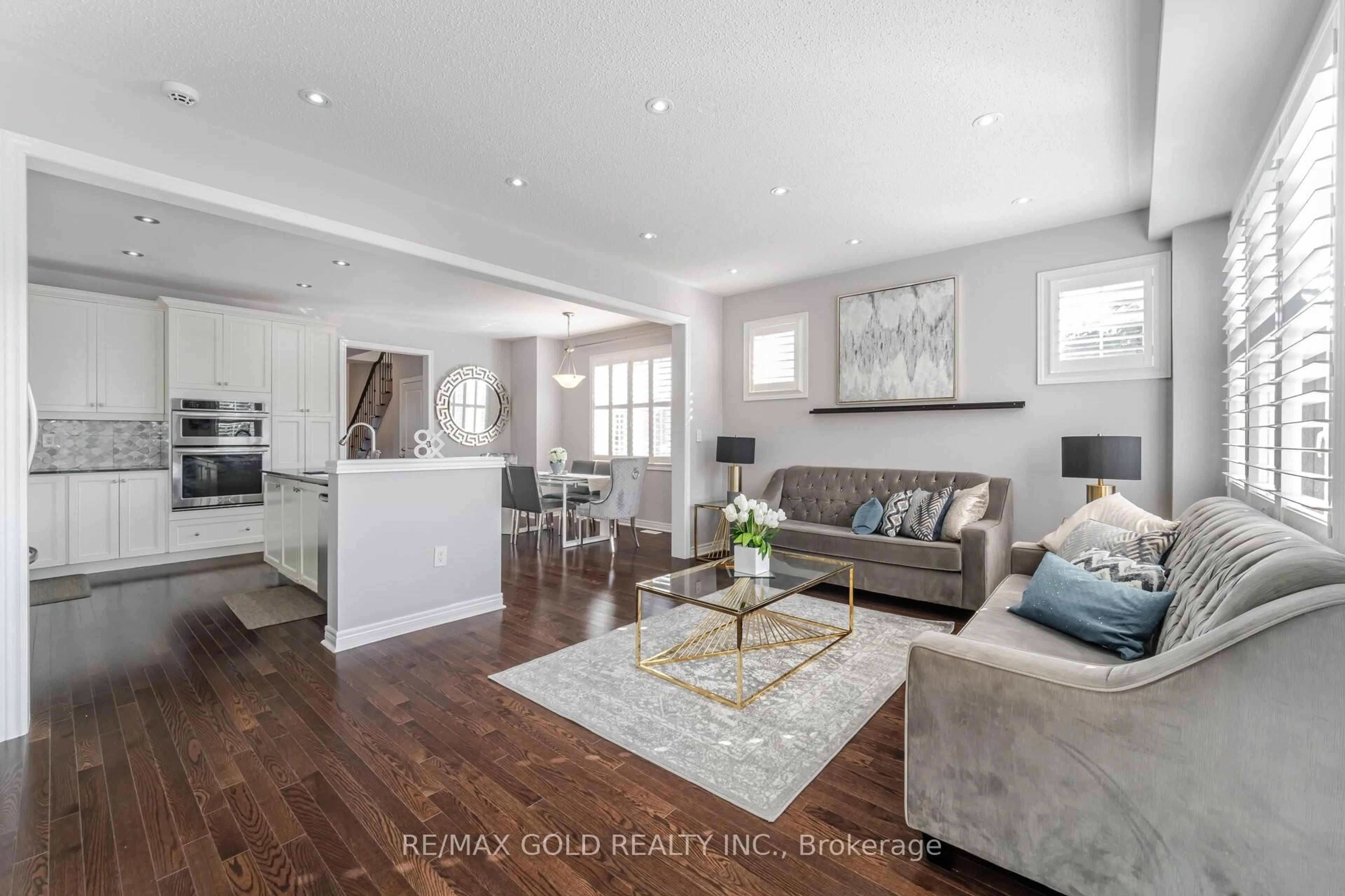 Living room with furniture, wood/laminate floor for 46 Lesabre Cres, Brampton Ontario L6P 3R4