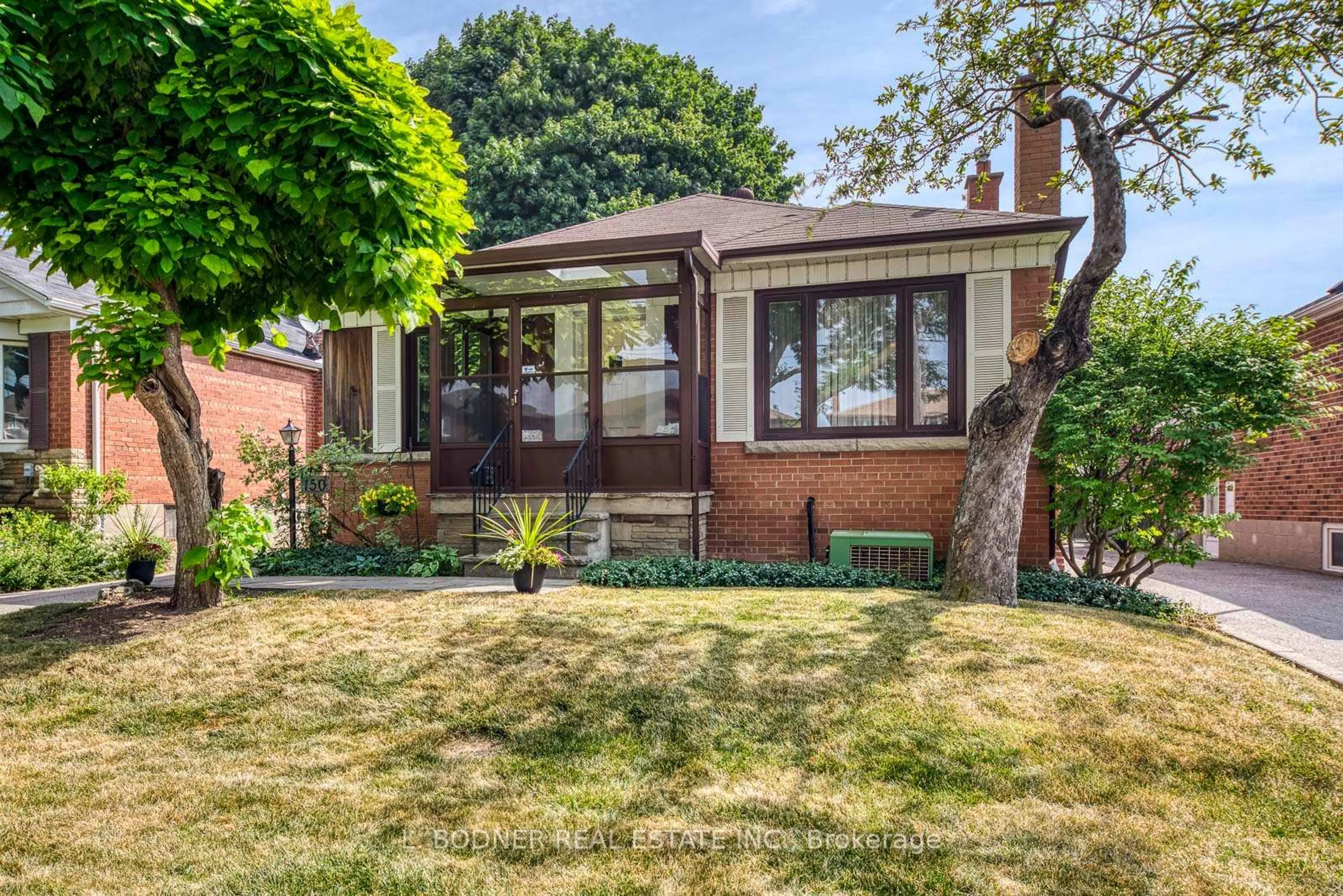 Home with brick exterior material, street for 150 Silverhill Dr, Toronto Ontario M9B 3W7
