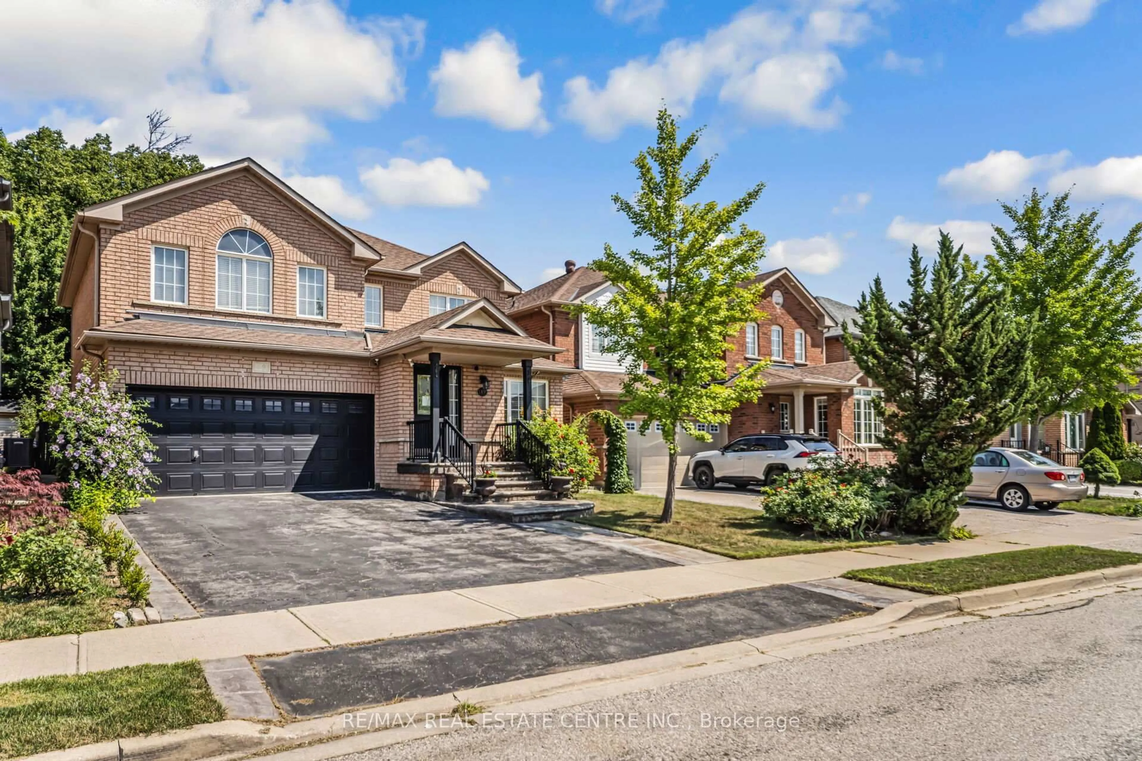 Home with brick exterior material, street for 19 Hollowgrove Blvd, Brampton Ontario L6P 1B1