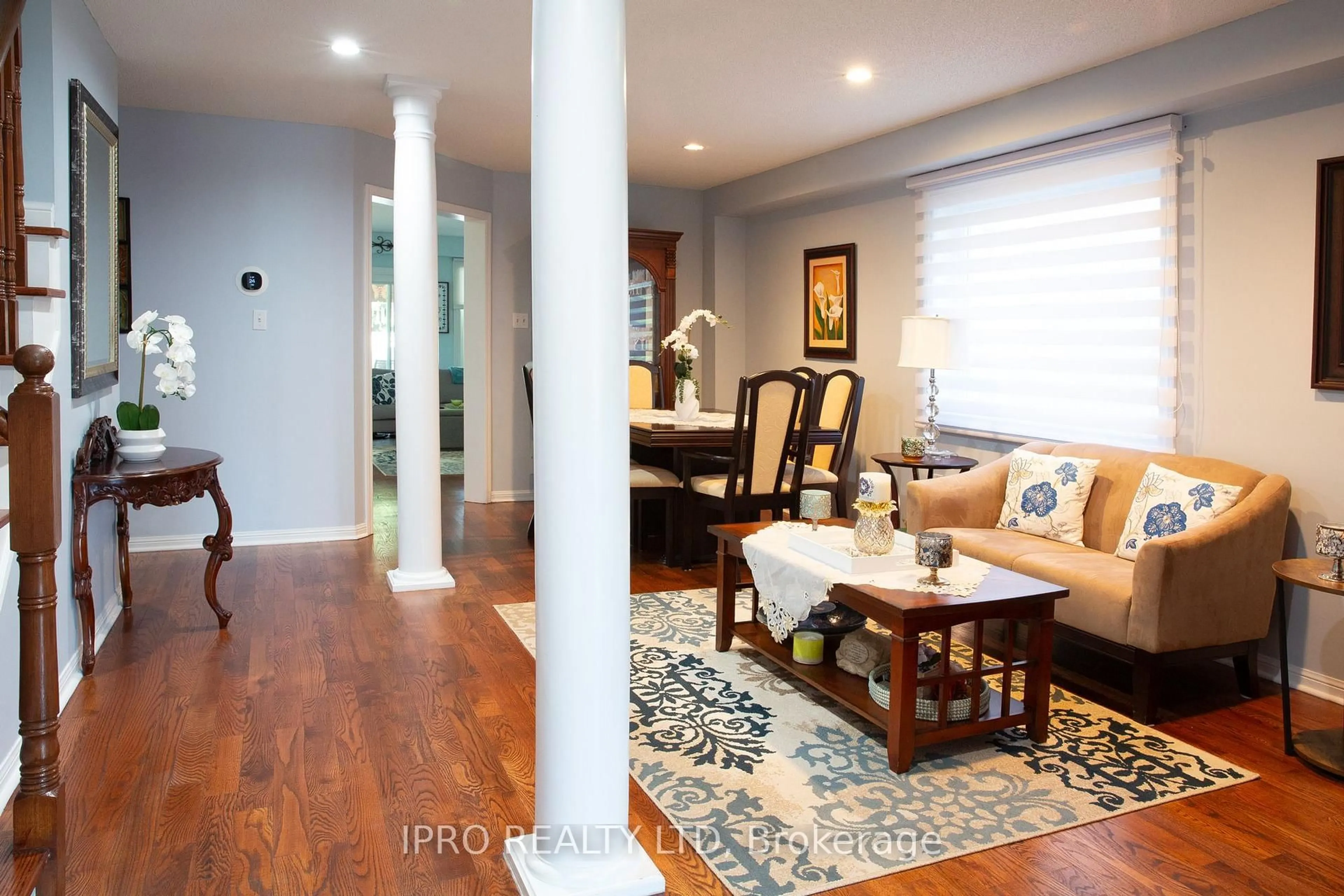 Living room with furniture, wood/laminate floor for 84 Weather Vane Lane, Brampton Ontario L6X 4R4