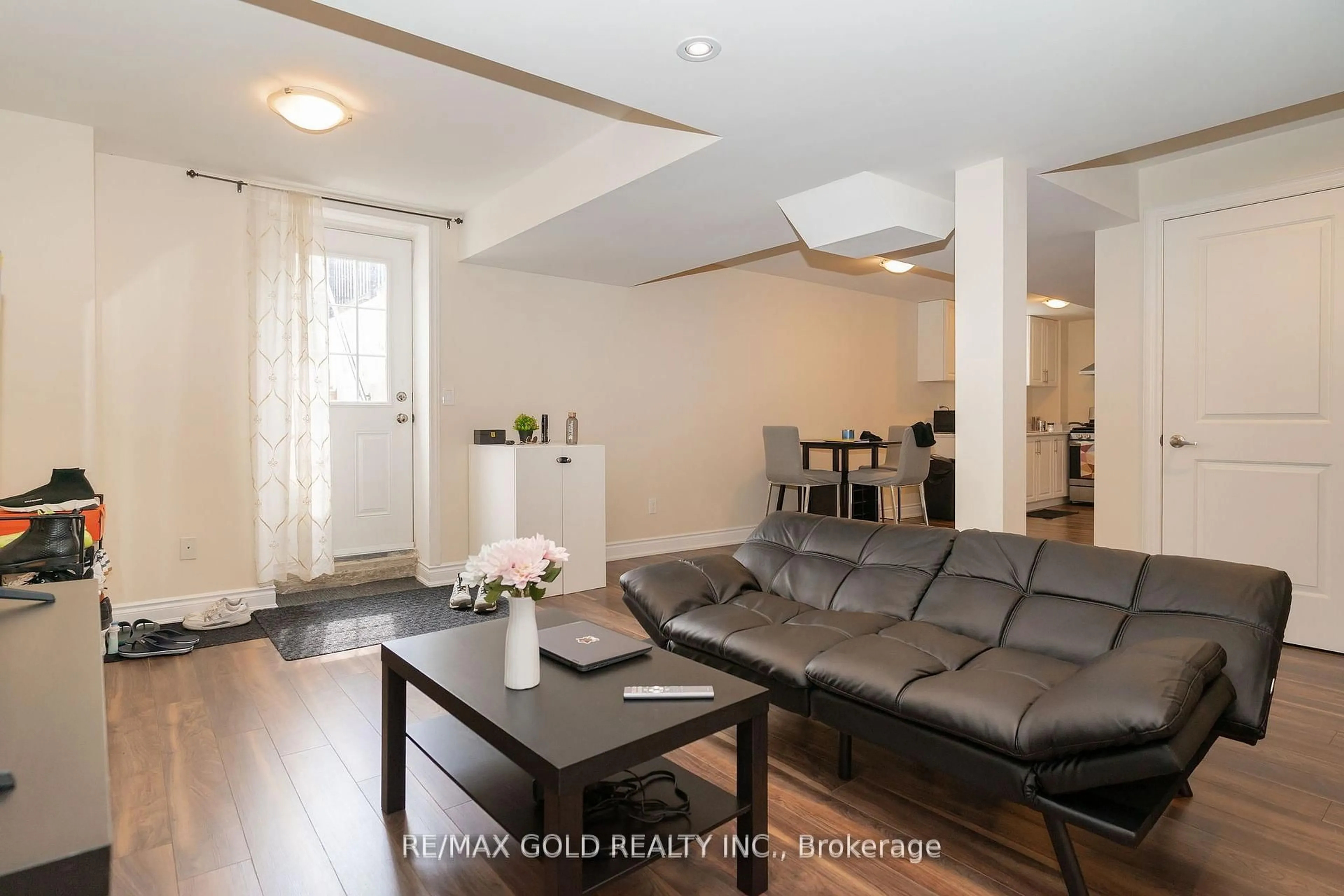 Living room with furniture, wood/laminate floor for 16 Palmvalley Dr, Brampton Ontario L6P 2V4