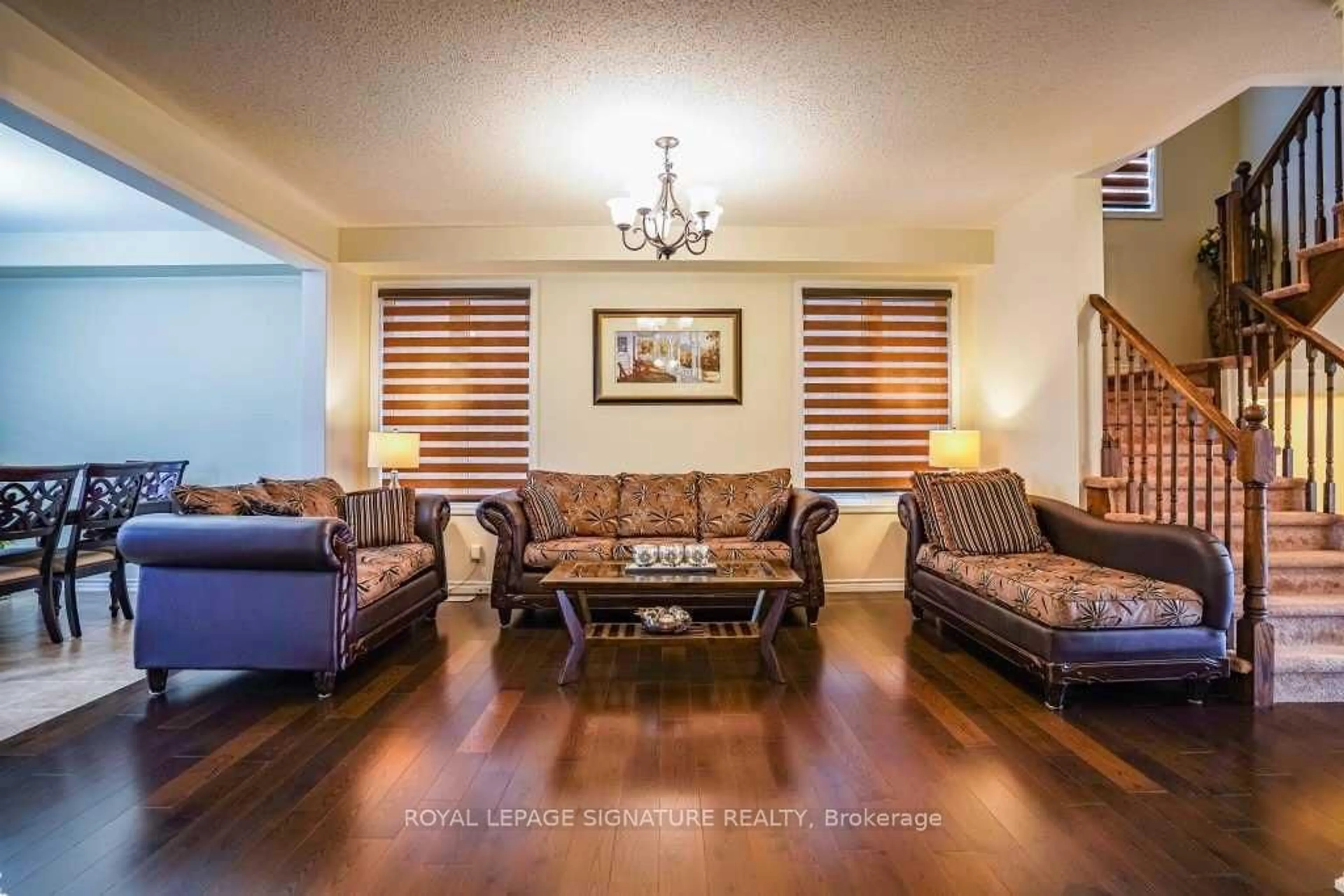 Living room with furniture, wood/laminate floor for 171 Buick Blvd, Brampton Ontario L7A 0Z1