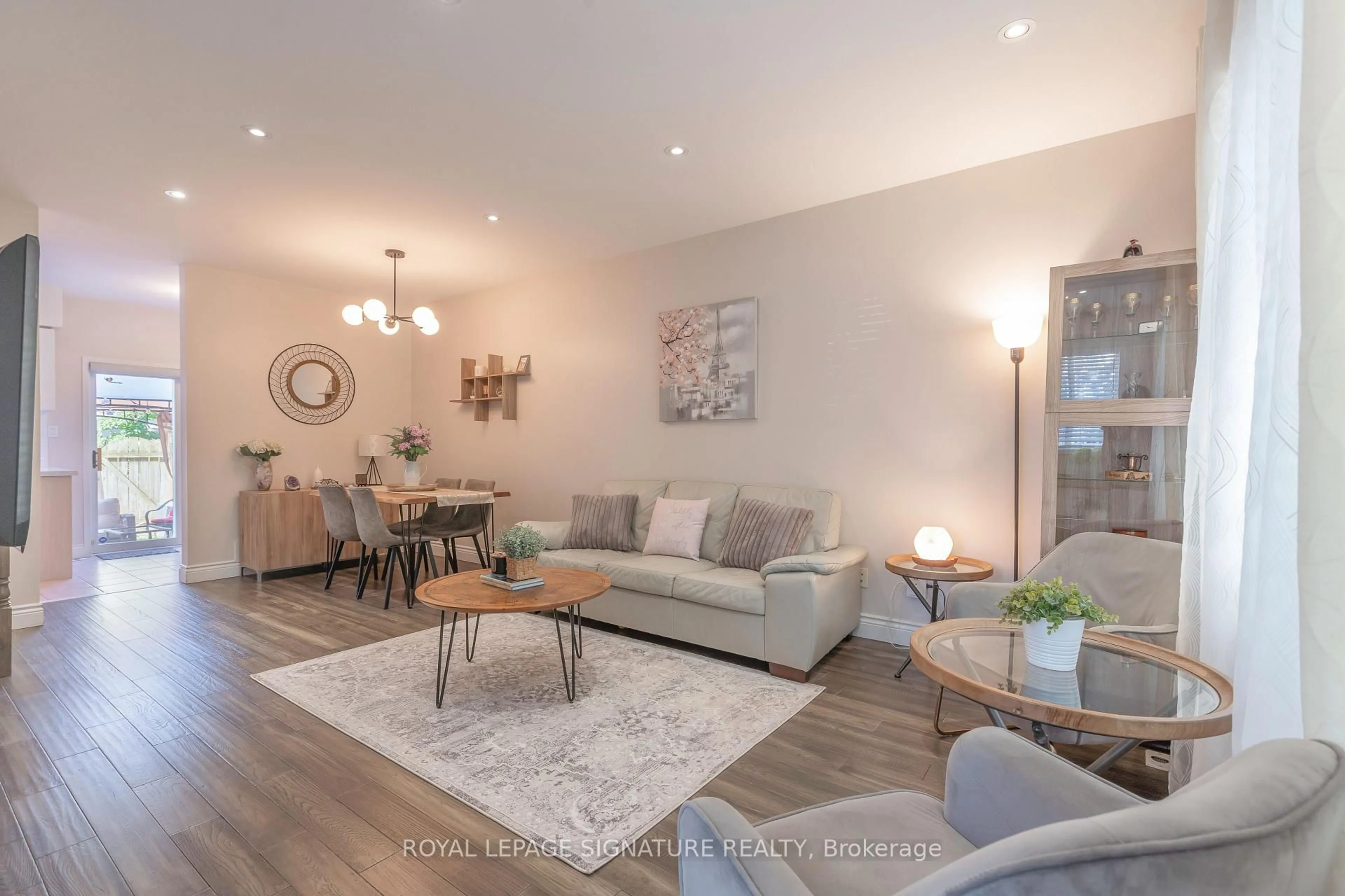 Living room with furniture, wood/laminate floor for 1184 Parkwest Pl, Mississauga Ontario L5E 3K2