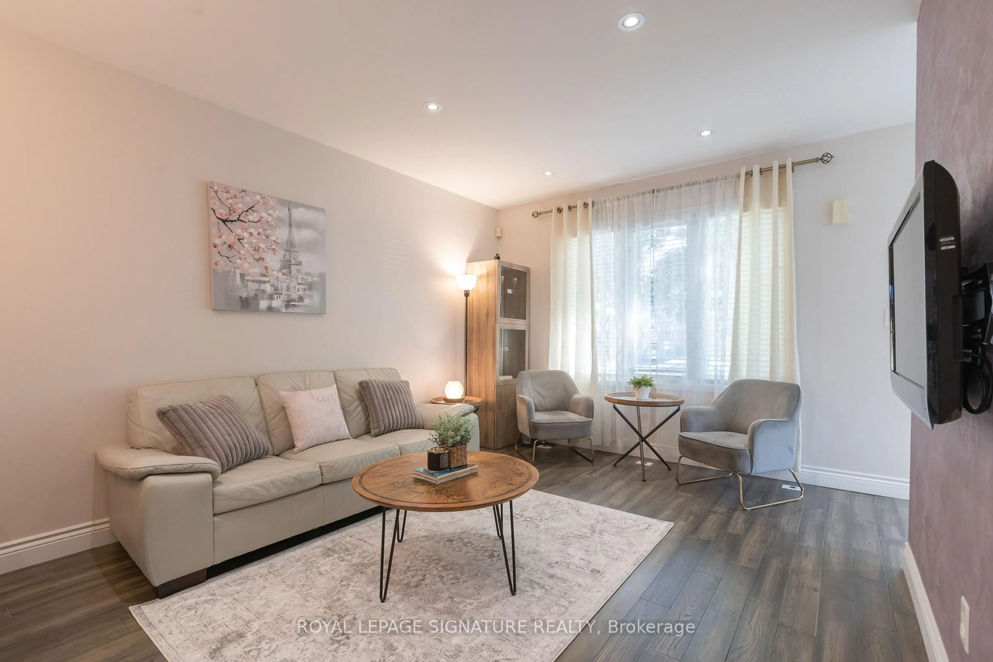 Living room with furniture, wood/laminate floor for 1184 Parkwest Pl, Mississauga Ontario L5E 3K2