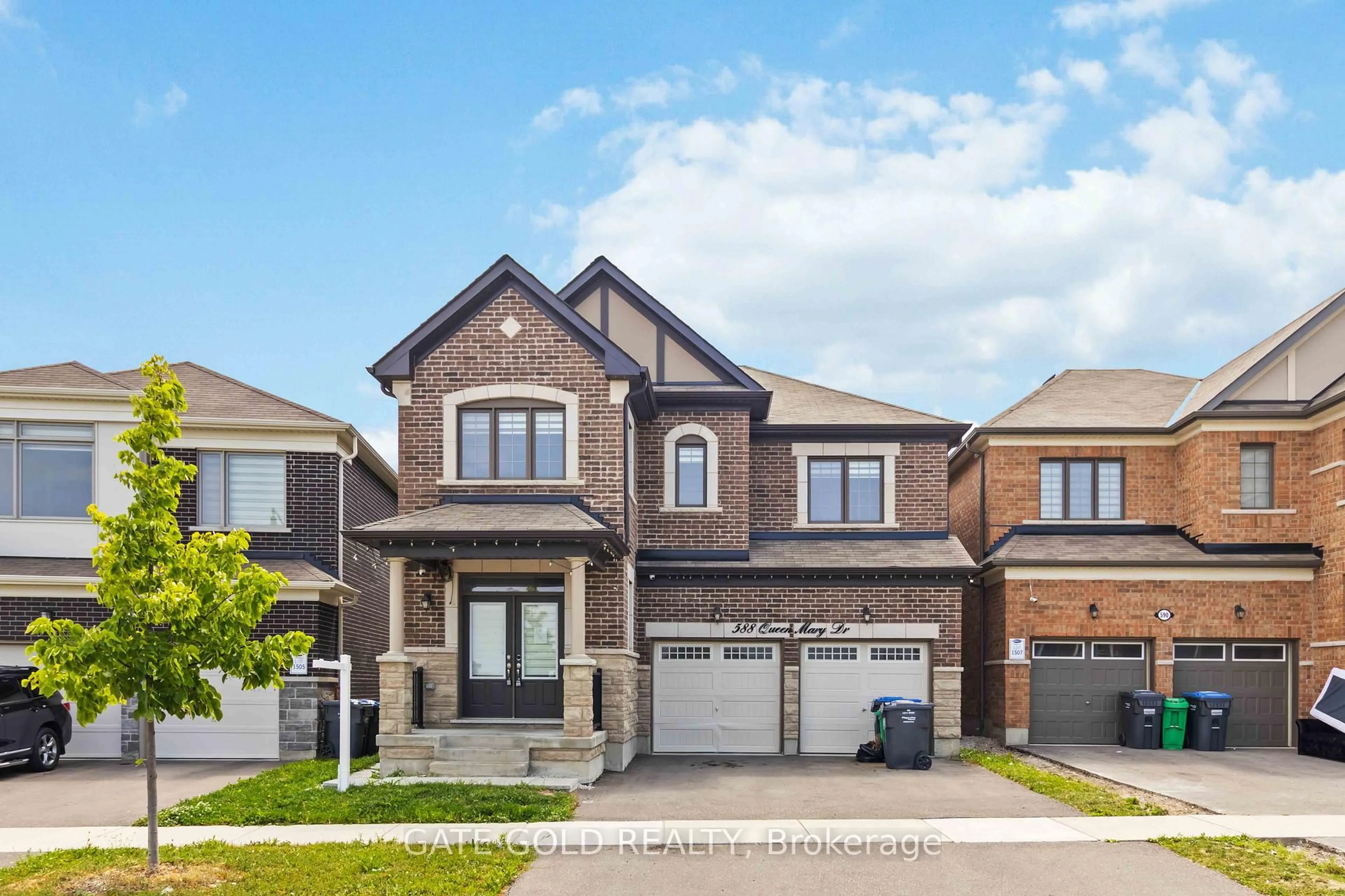 Home with brick exterior material, street for 588 Queen Mary Dr, Brampton Ontario L7A 5H5