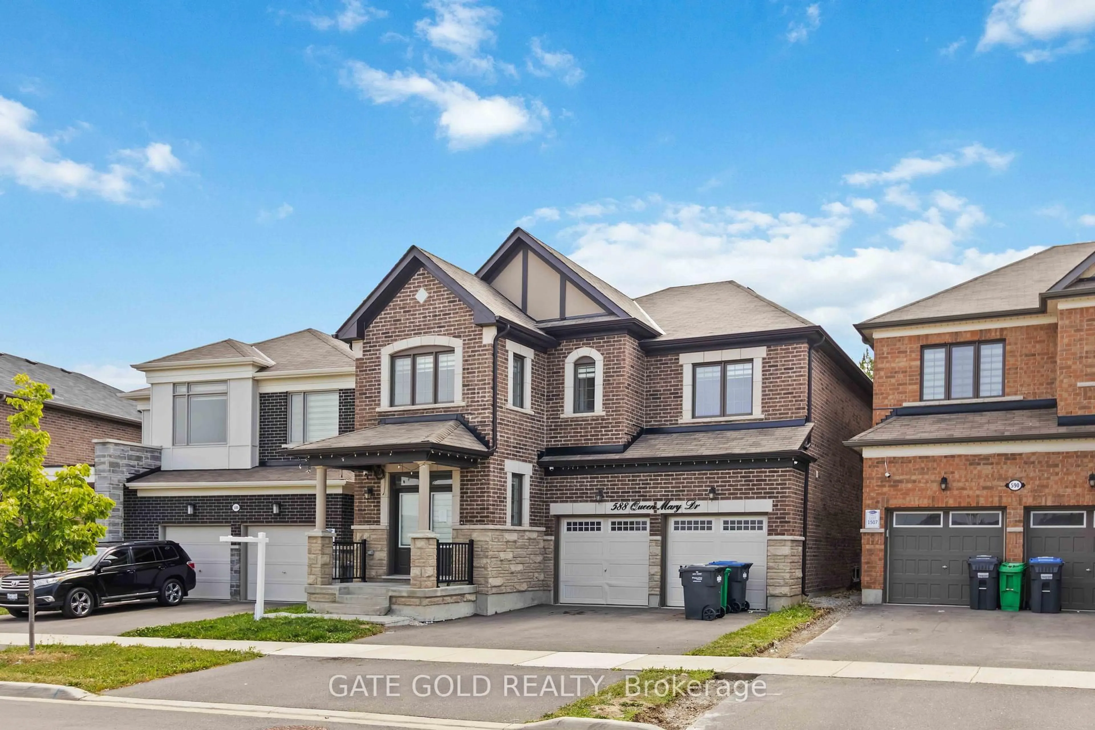 Home with brick exterior material, street for 588 Queen Mary Dr, Brampton Ontario L7A 5H5