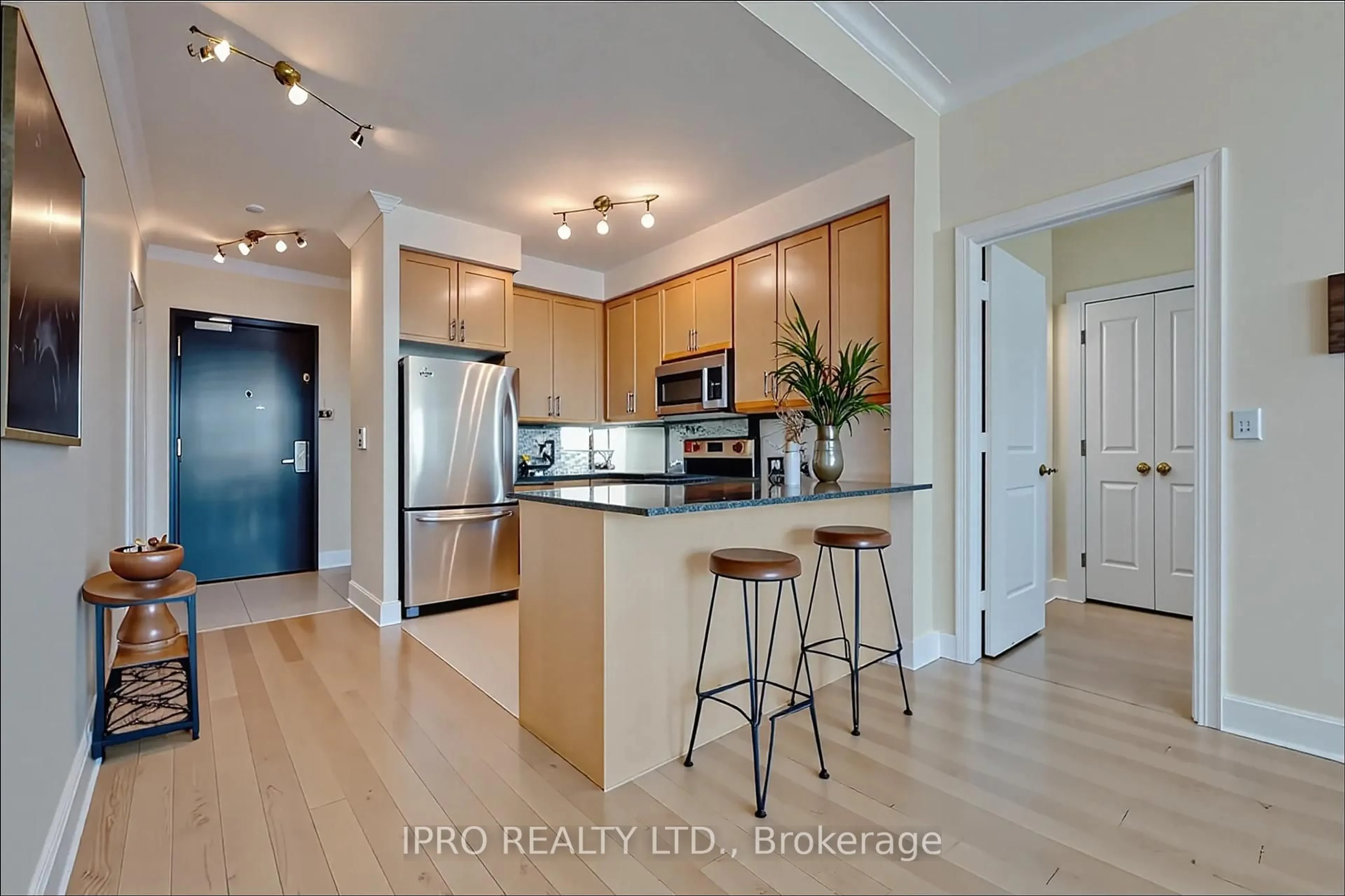 Open concept kitchen, wood/laminate floor for 90 Absolute Ave #2701, Mississauga Ontario L4Z 0A3