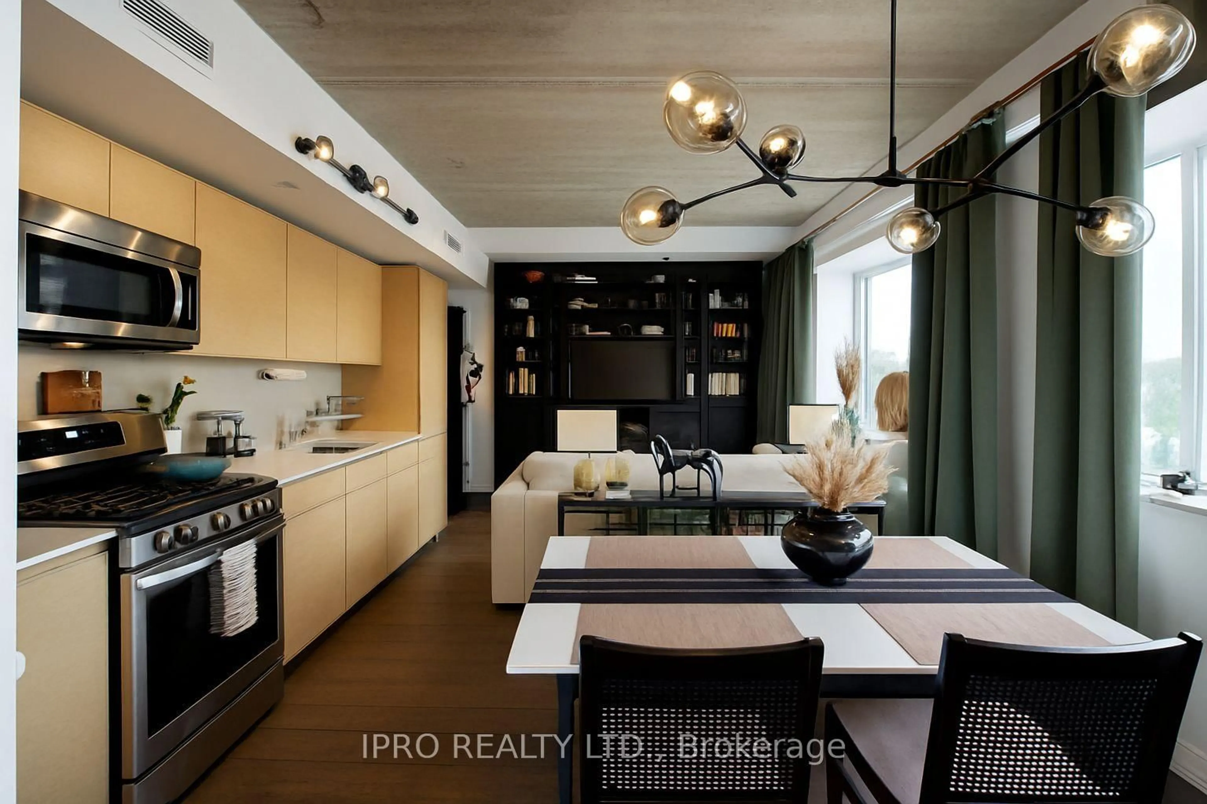 Open concept kitchen, wood/laminate floor for 51 Lady Bank Rd #203, Toronto Ontario M8Z 0C9