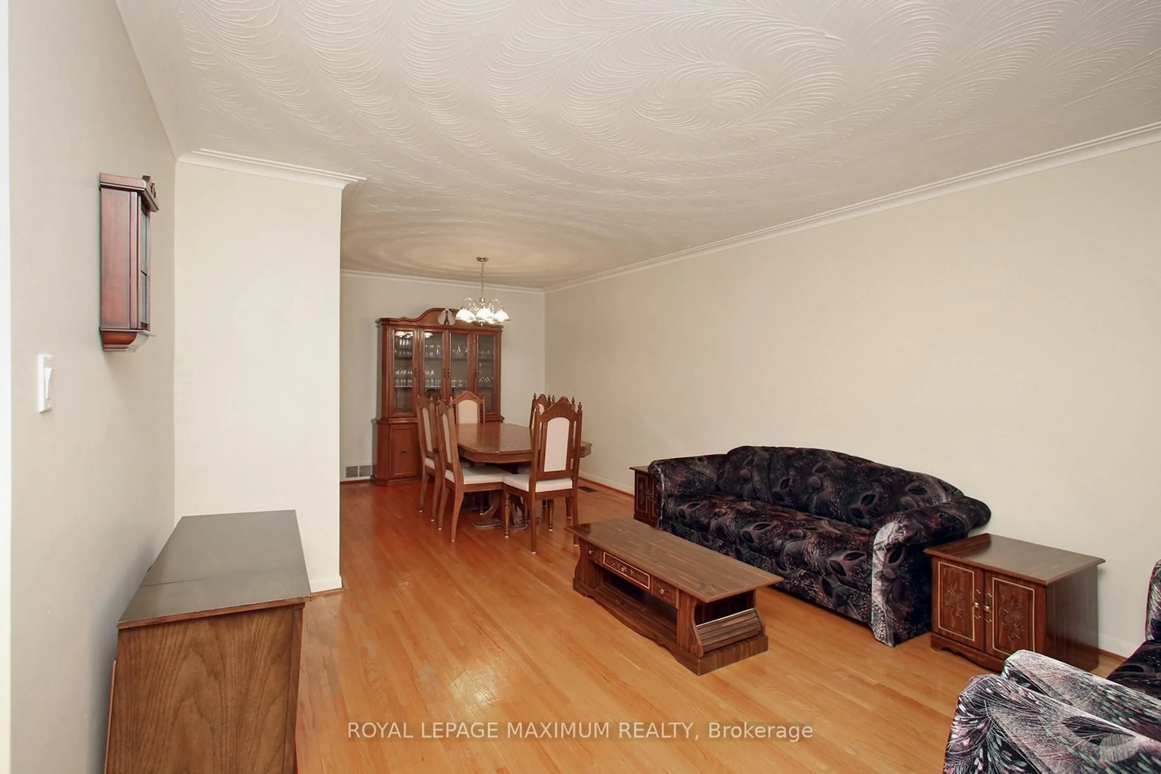 Living room with furniture, wood/laminate floor for 159 Spenvalley Dr, Toronto Ontario M3L 1Z8