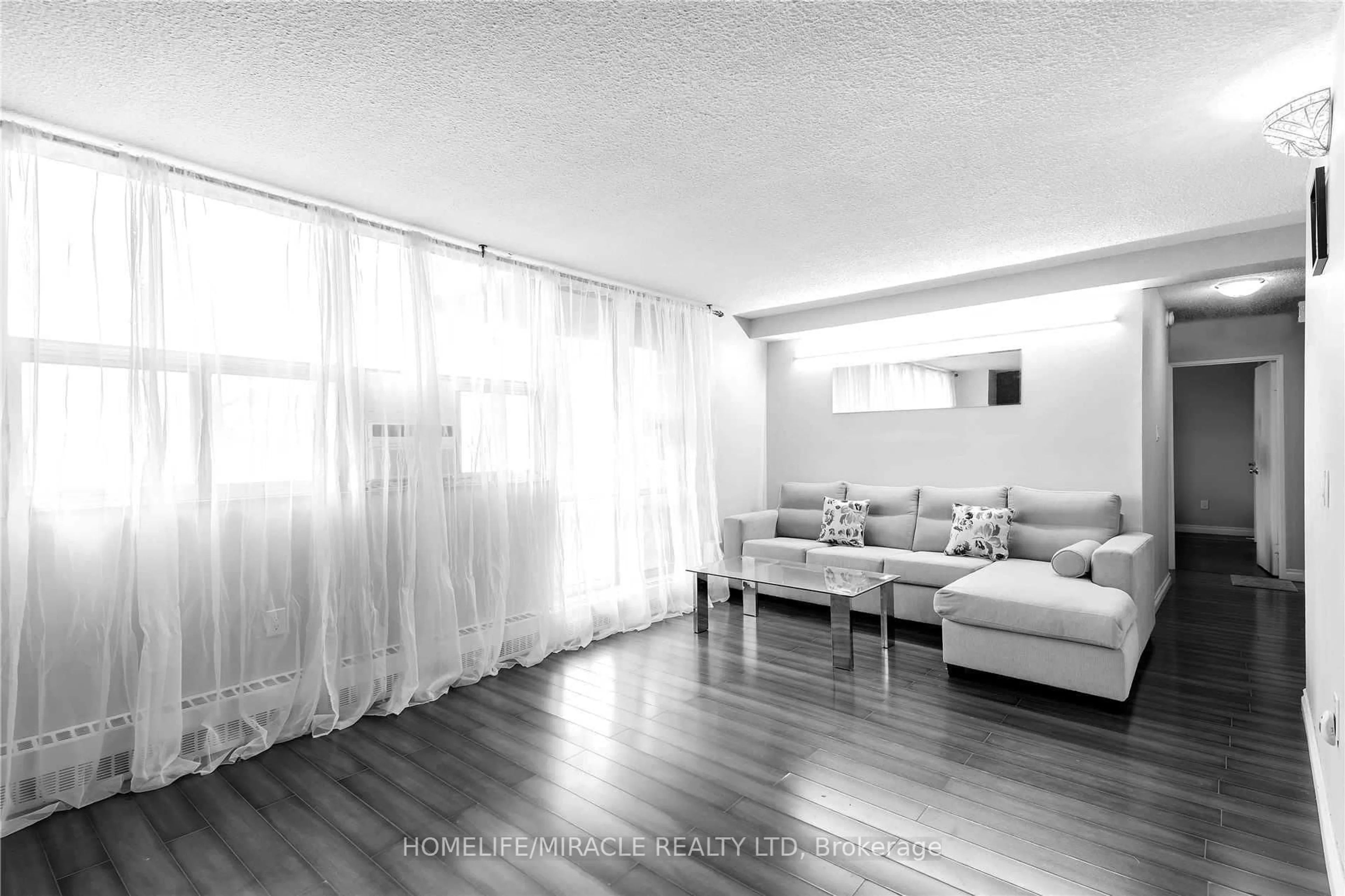 Living room with furniture, wood/laminate floor for 2645 Kipling Ave #404, Toronto Ontario M9V 3S6