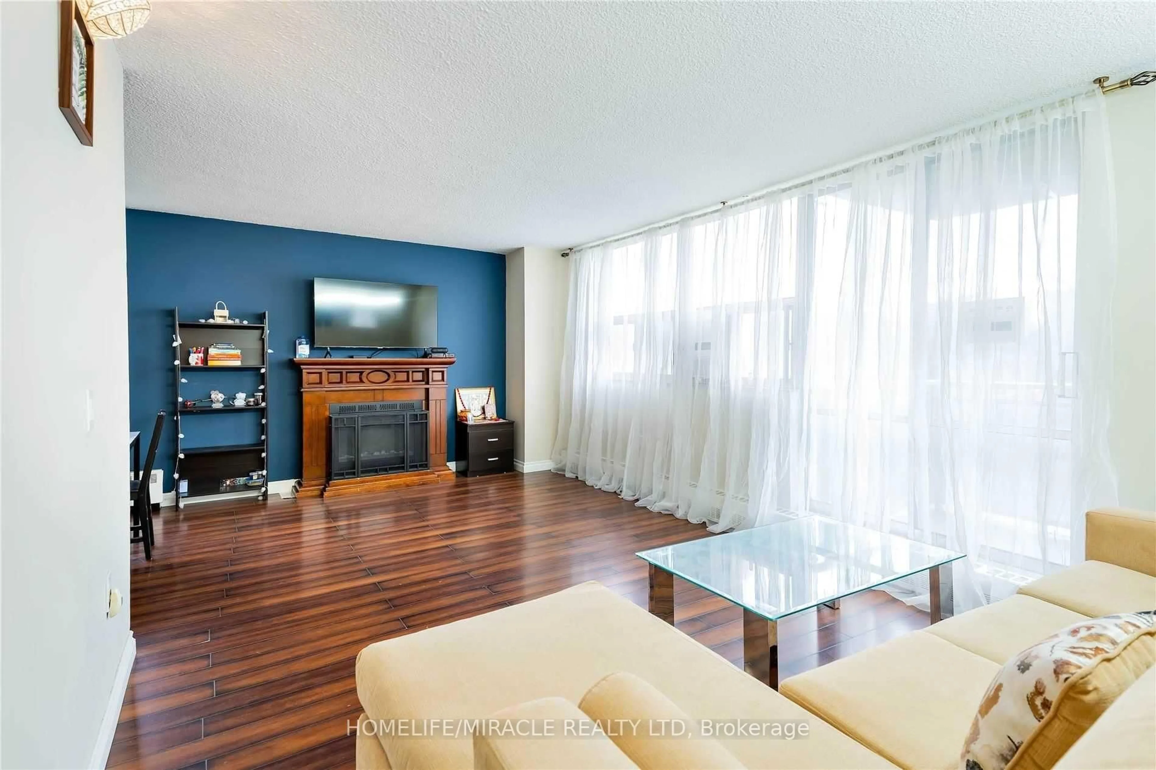 Living room with furniture, wood/laminate floor for 2645 Kipling Ave #404, Toronto Ontario M9V 3S6
