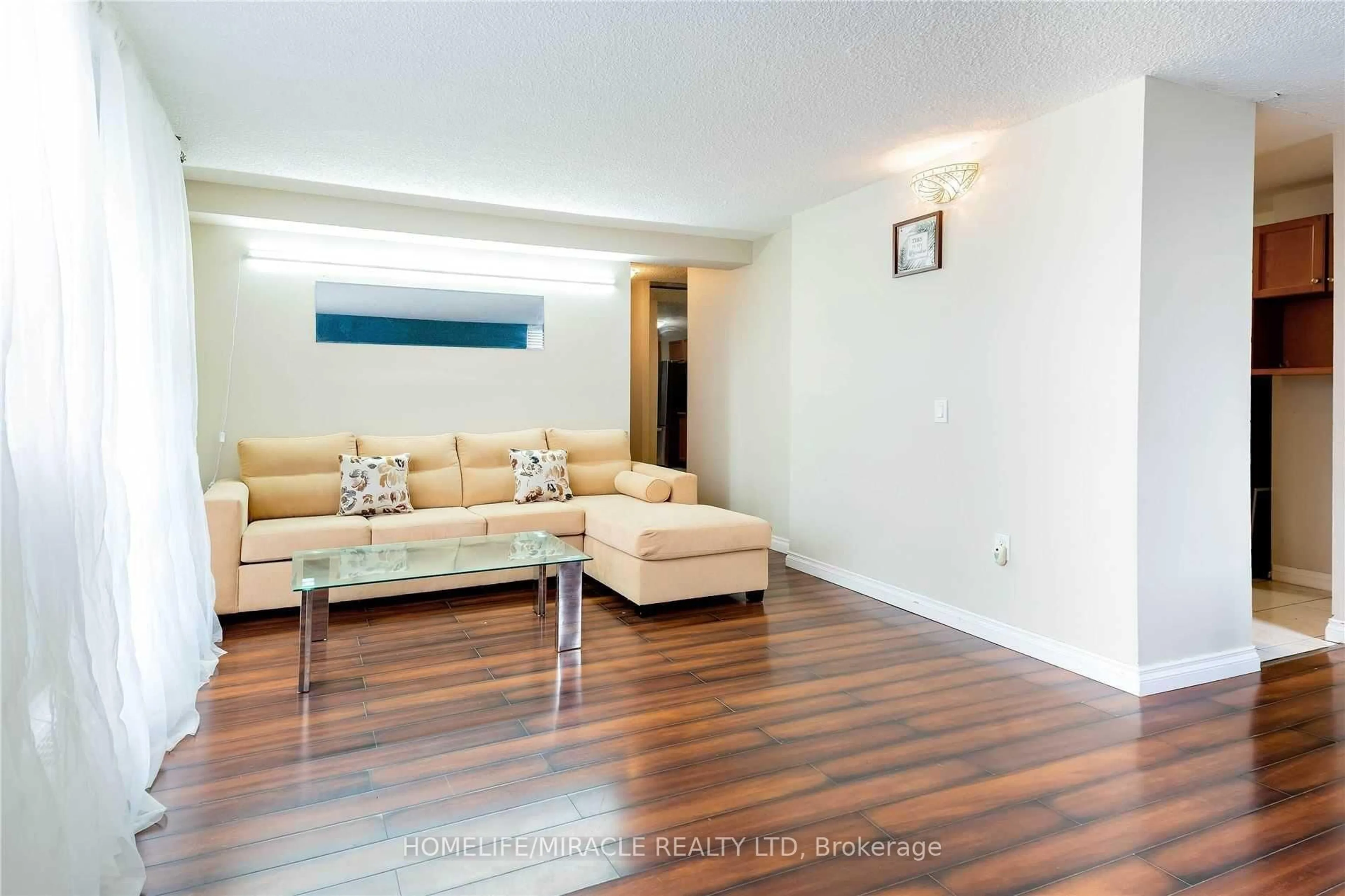 Living room with furniture, wood/laminate floor for 2645 Kipling Ave #404, Toronto Ontario M9V 3S6