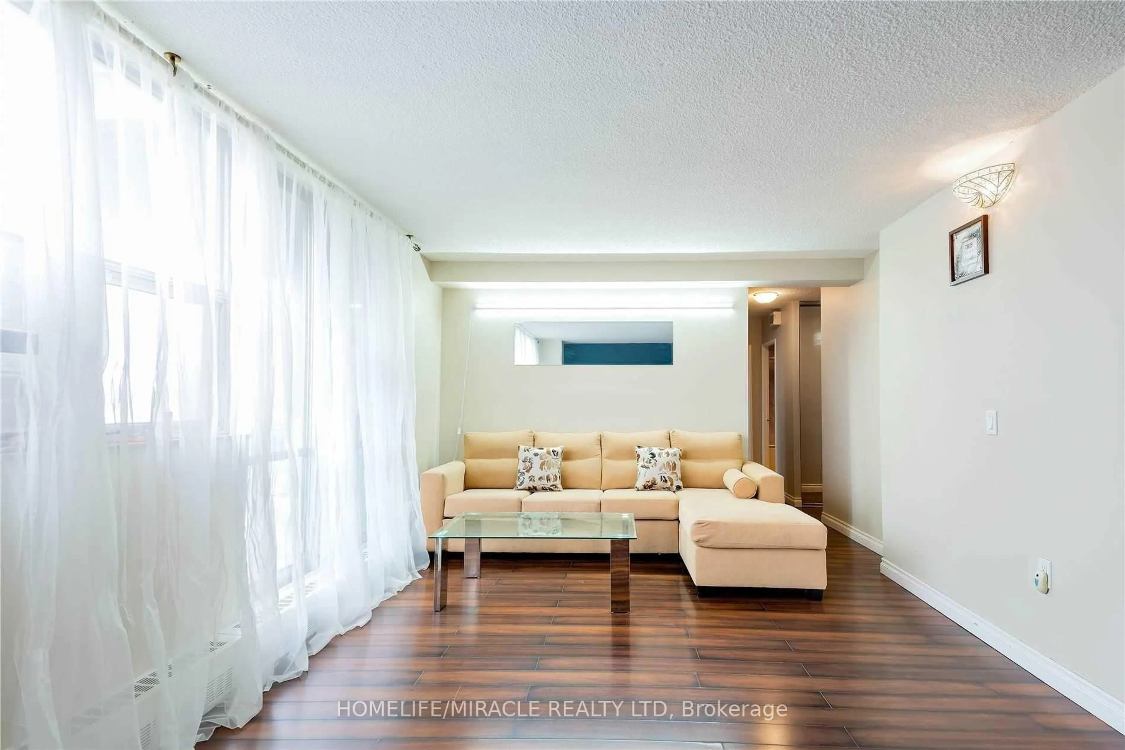 Living room with furniture, wood/laminate floor for 2645 Kipling Ave #404, Toronto Ontario M9V 3S6