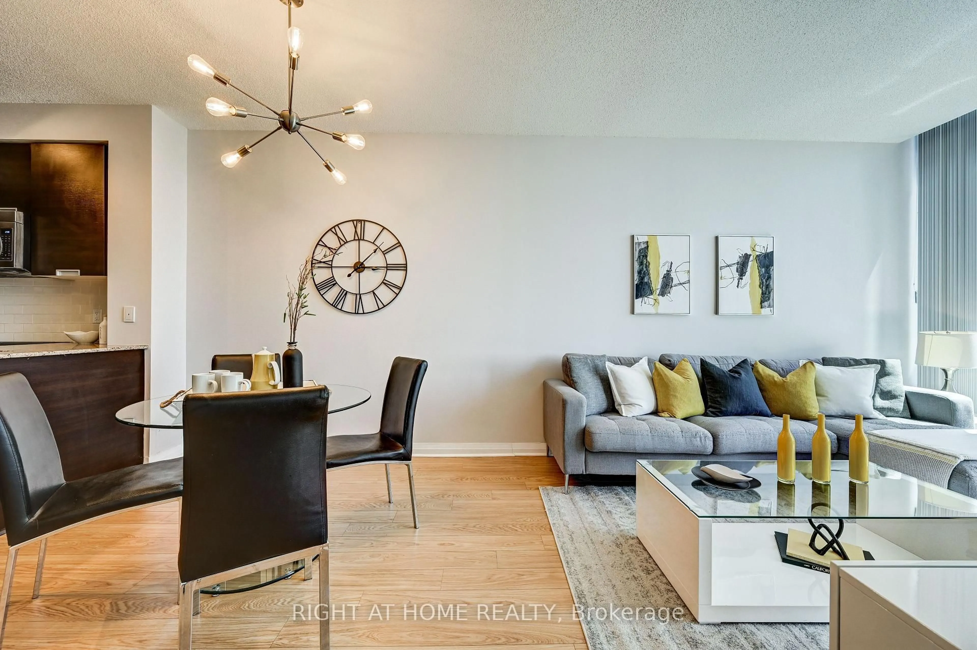 Living room with furniture, wood/laminate floor for 55 Eglinton Ave #2001, Mississauga Ontario L5R 0E4