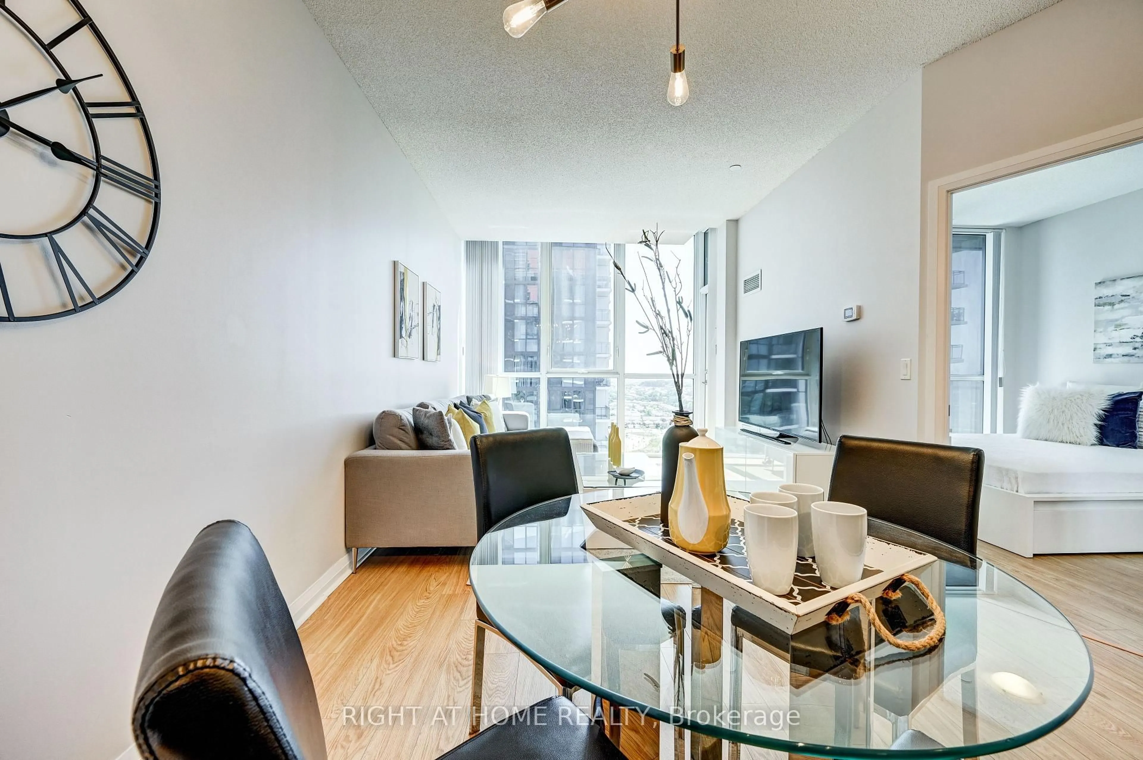 Living room with furniture, wood/laminate floor for 55 Eglinton Ave #2001, Mississauga Ontario L5R 0E4
