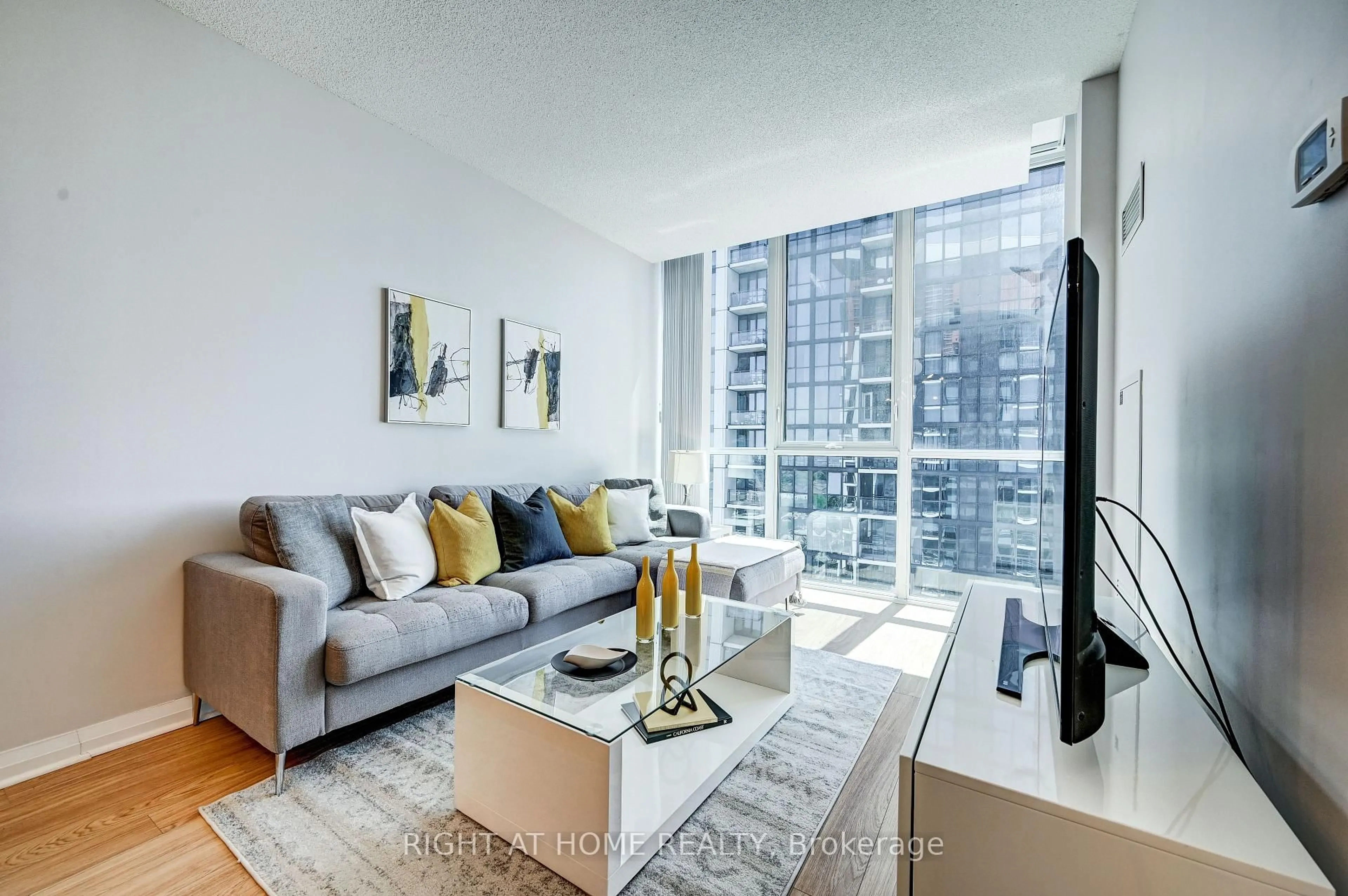 Living room with furniture, unknown for 55 Eglinton Ave #2001, Mississauga Ontario L5R 0E4