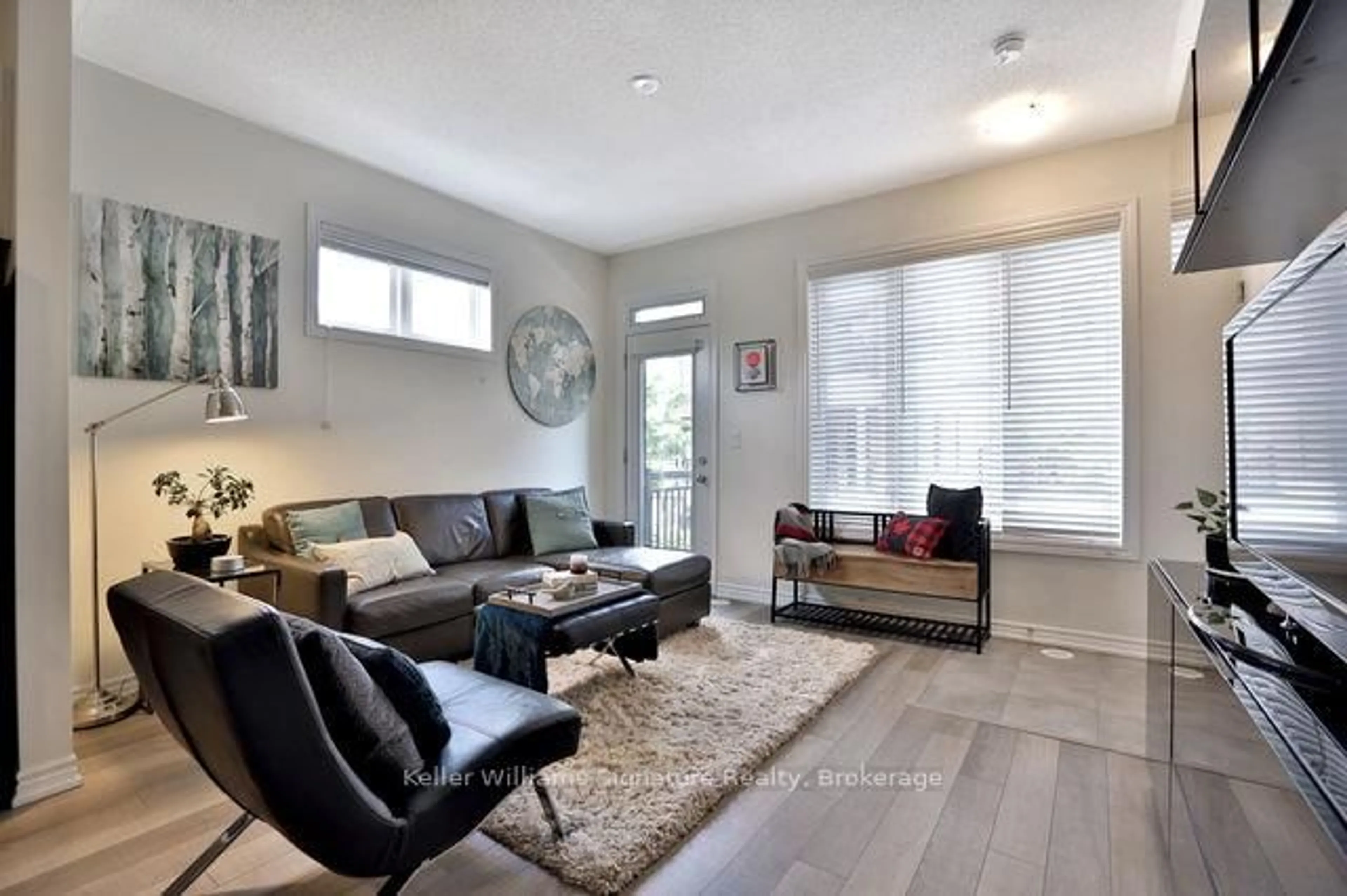 Living room with furniture, wood/laminate floor for 30 Carnation Ave #90, Toronto Ontario M8V 0B8