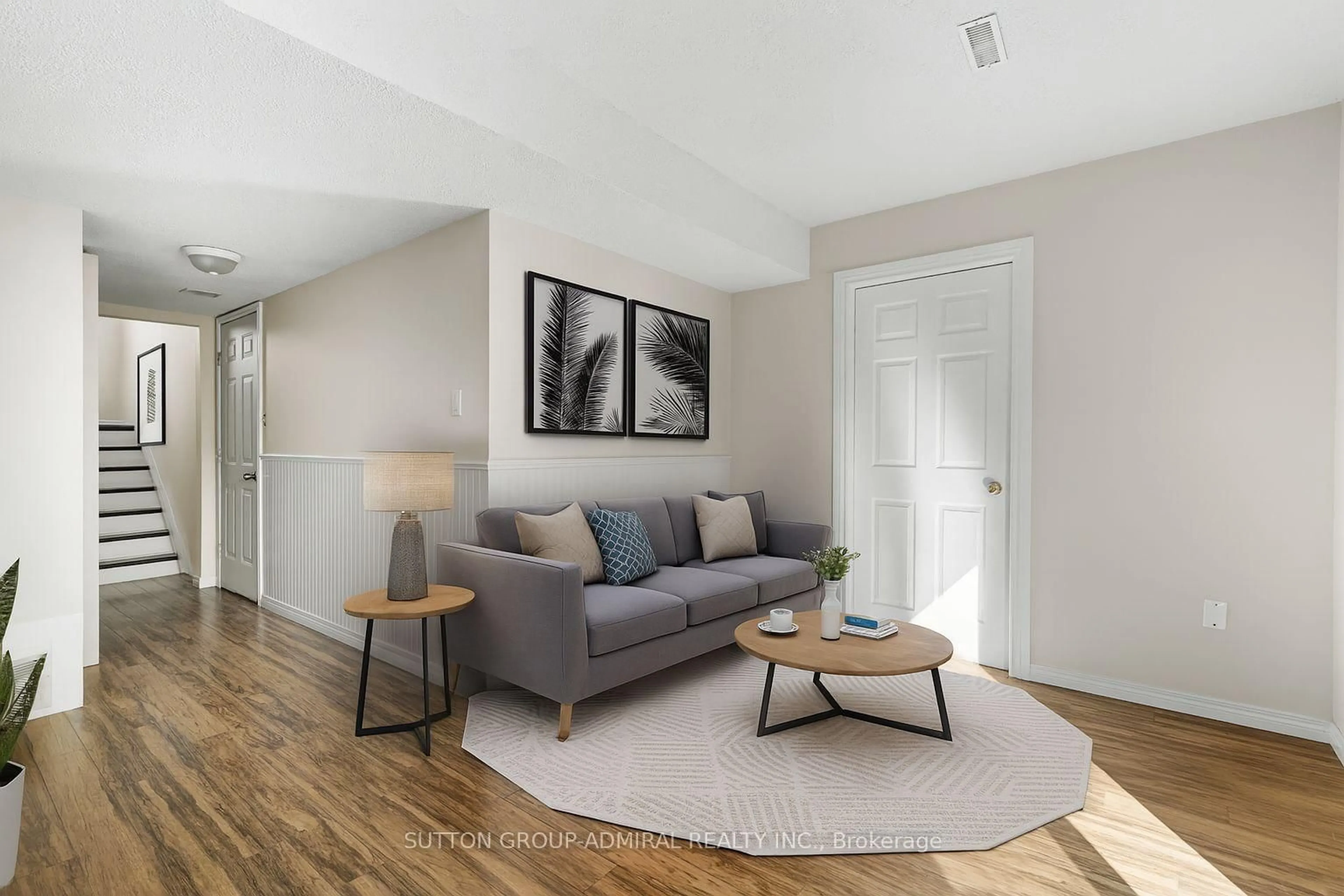 Living room with furniture, wood/laminate floor for 7340 Copenhagen Rd #63, Mississauga Ontario L5N 2S5