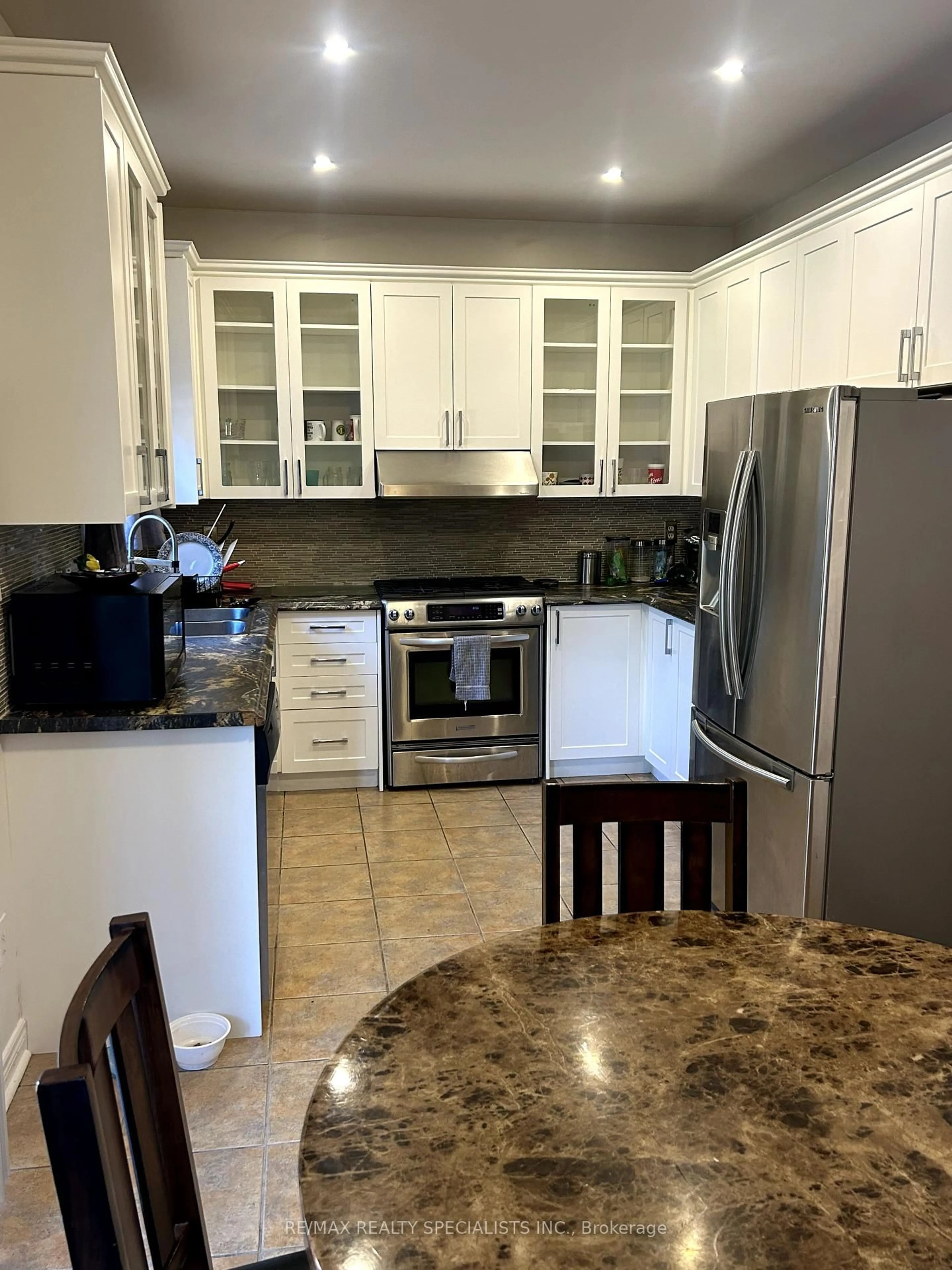 Open concept kitchen, ceramic/tile floor for 64 Mossgrove Cres, Brampton Ontario L7A 3E6