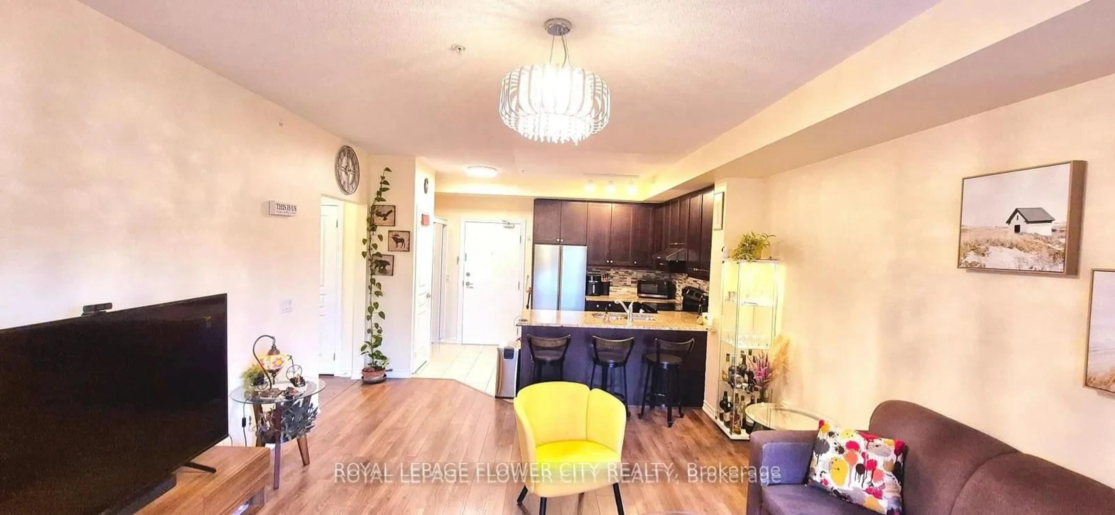 Open concept kitchen, wood/laminate floor for 570 Lolita Gdns #215, Mississauga Ontario L5A 0A1