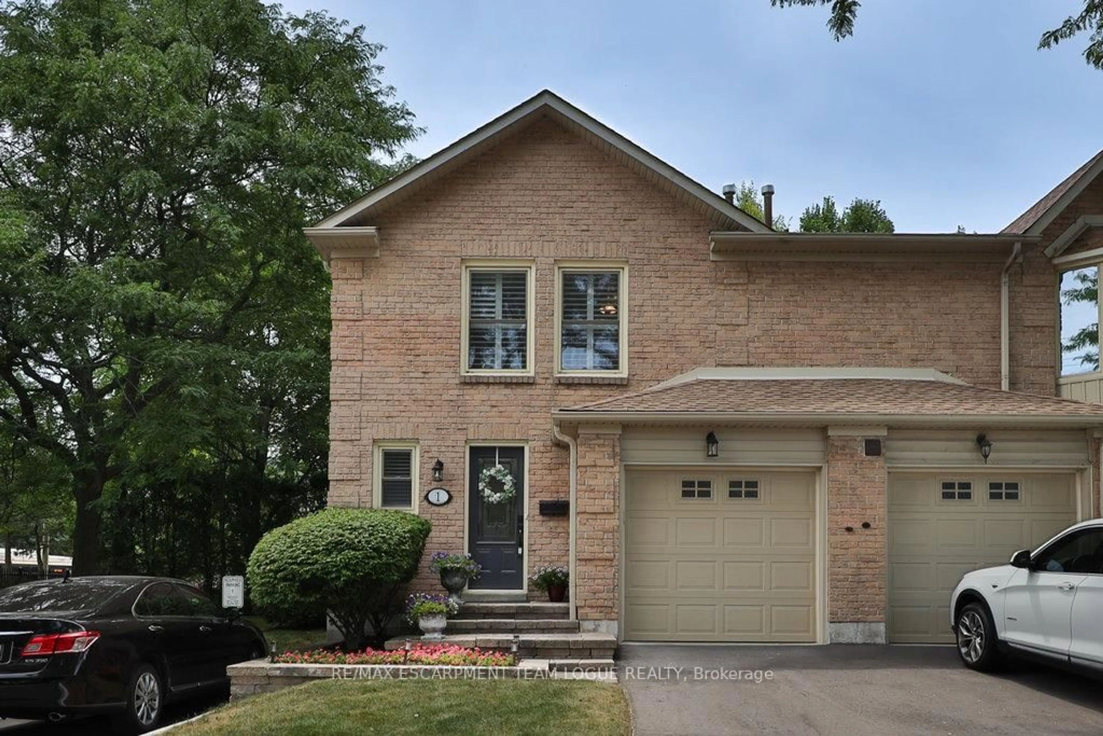 Home with brick exterior material, street for 5411 Lakeshore Rd #1, Burlington Ontario L7L 1E1
