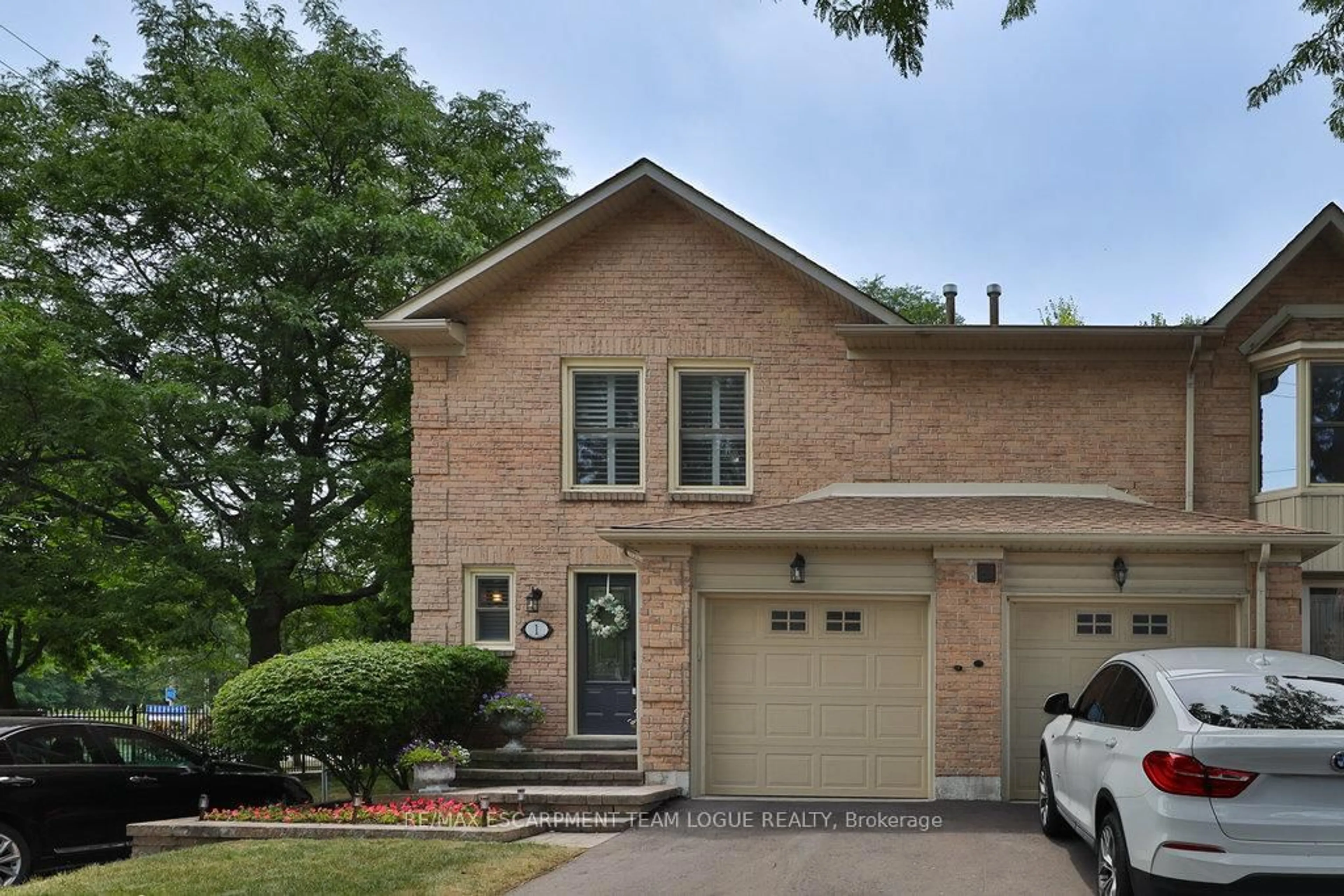 Home with brick exterior material, street for 5411 Lakeshore Rd #1, Burlington Ontario L7L 1E1