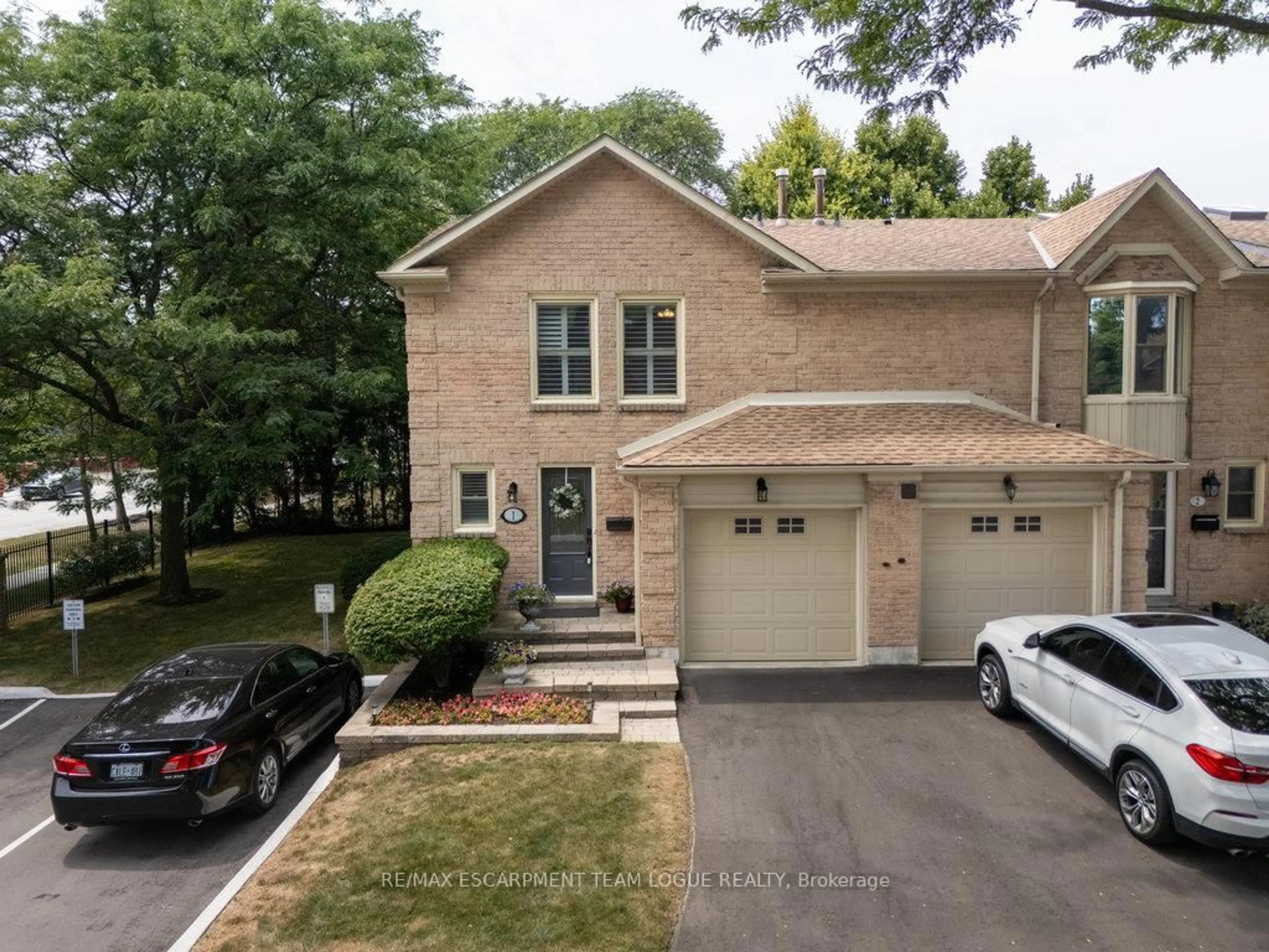 Home with brick exterior material, street for 5411 Lakeshore Rd #1, Burlington Ontario L7L 1E1