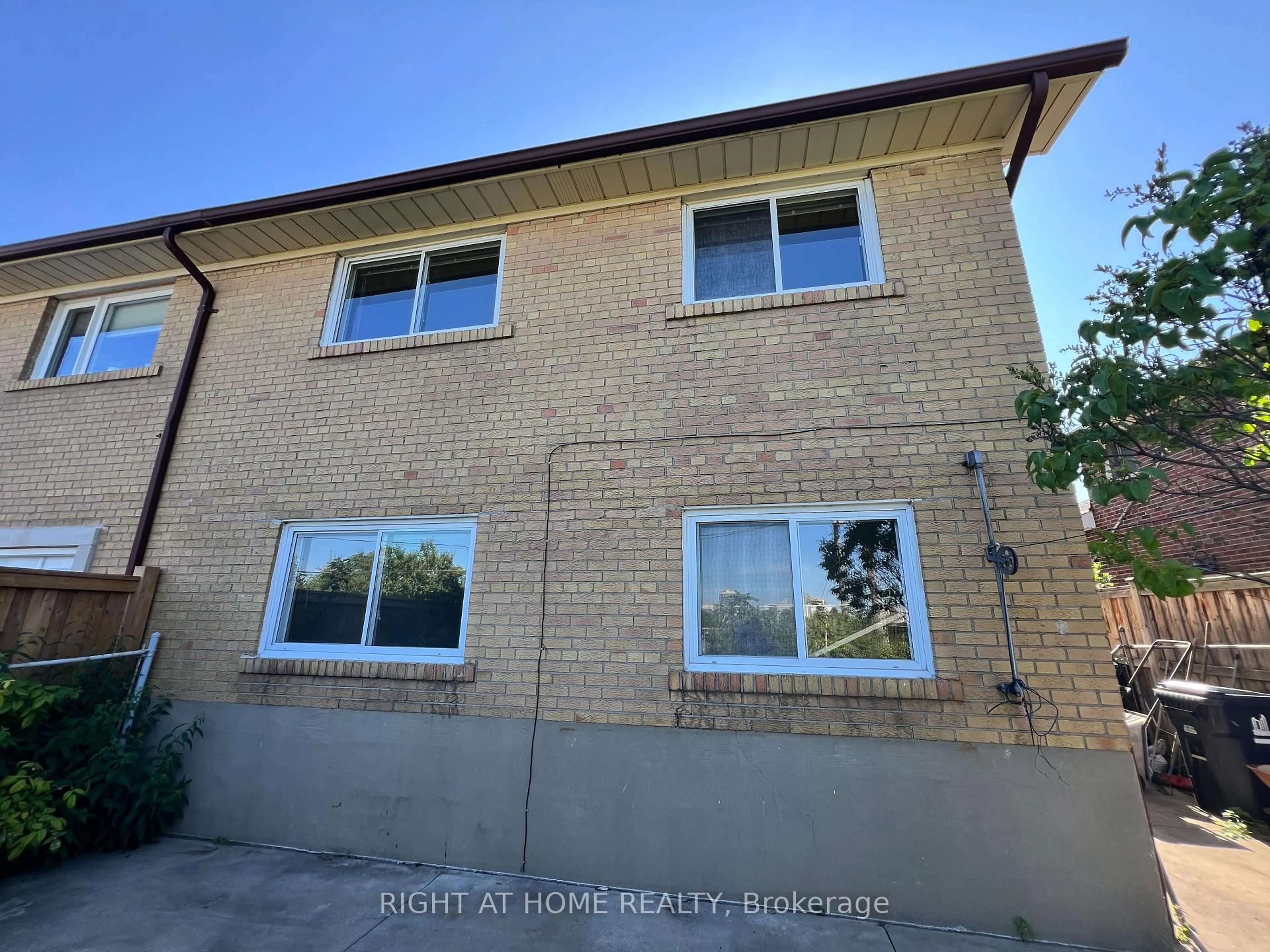 Home with brick exterior material, street for 21 Featherwood Pl, Toronto Ontario M9A 4V7