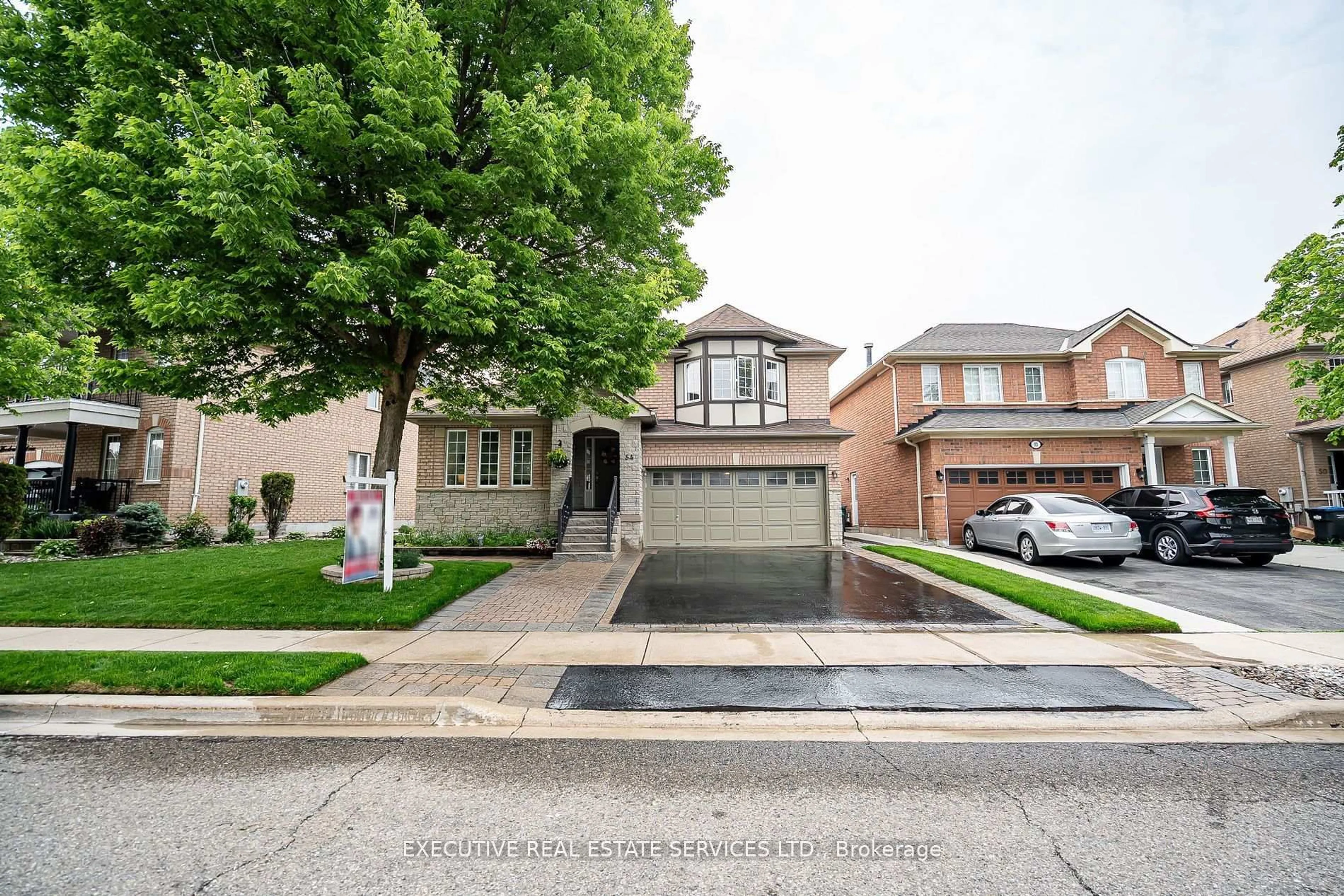 Home with brick exterior material, street for 54 Woodvalley Dr, Brampton Ontario L7A 1Z3