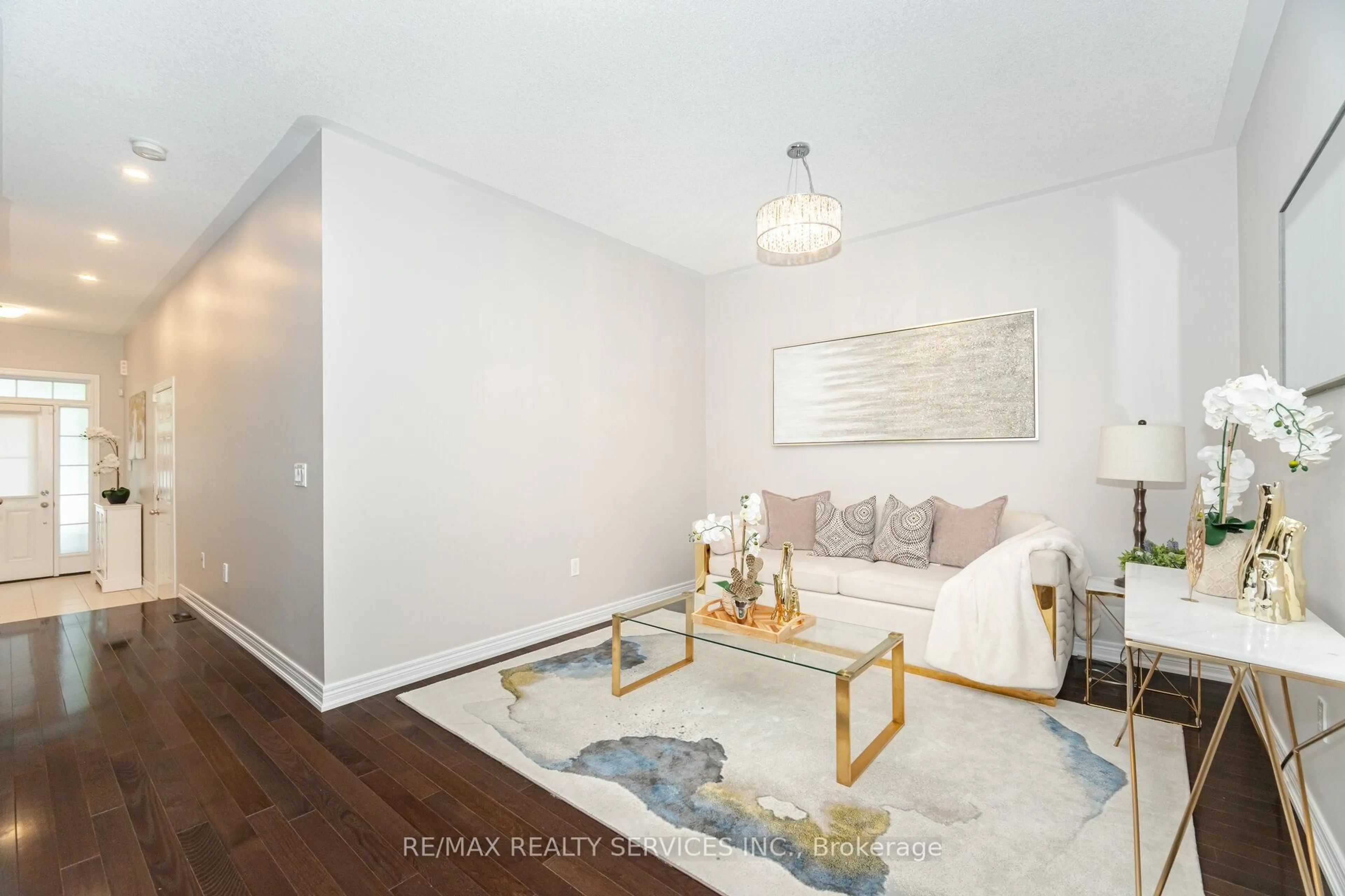 Living room with furniture, wood/laminate floor for 20 Zephyr Rd, Caledon Ontario L7C 3V8
