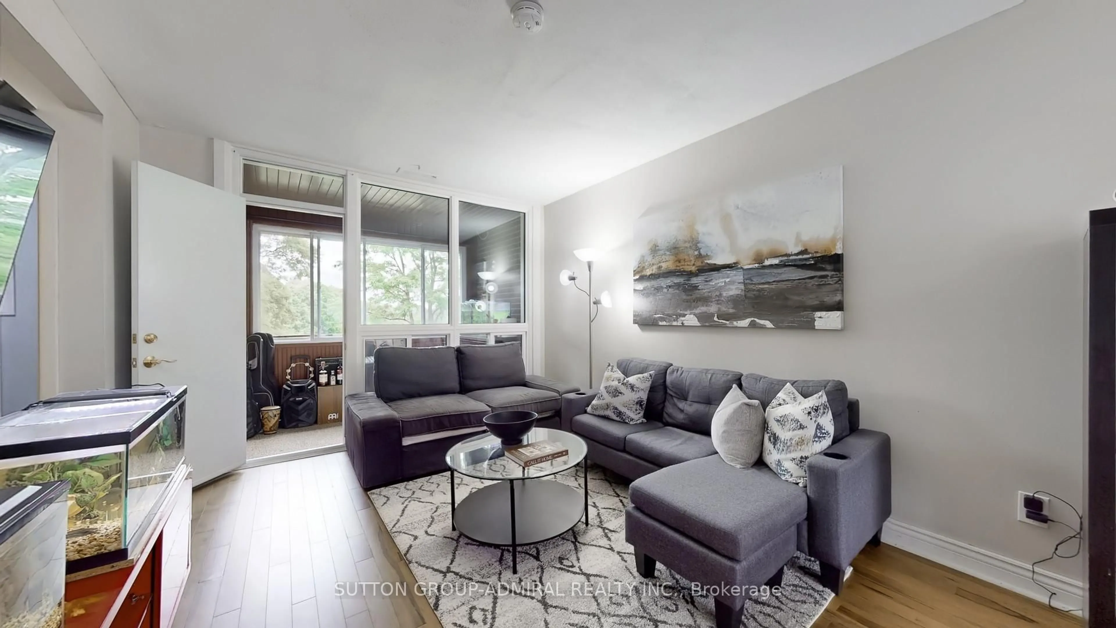 Living room with furniture, wood/laminate floor for 22 Tandridge Cres #812, Toronto Ontario M9W 2P2