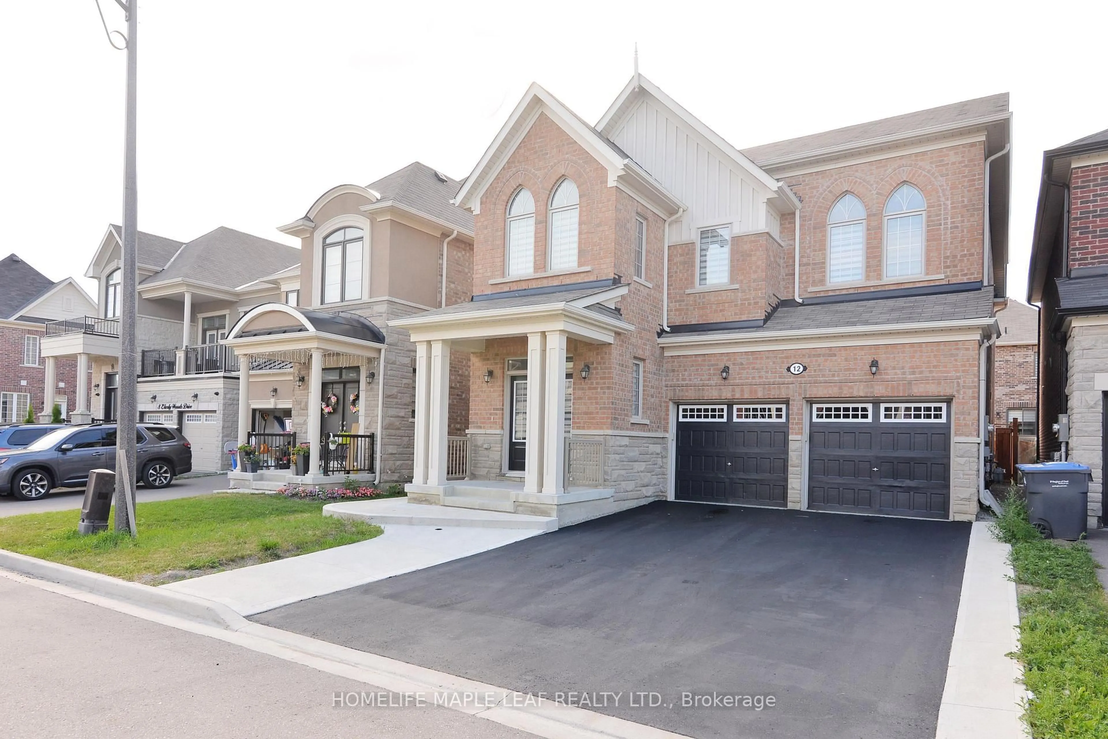 Home with brick exterior material, street for 12 Eberly Woods Dr, Caledon Ontario L7C 4H8
