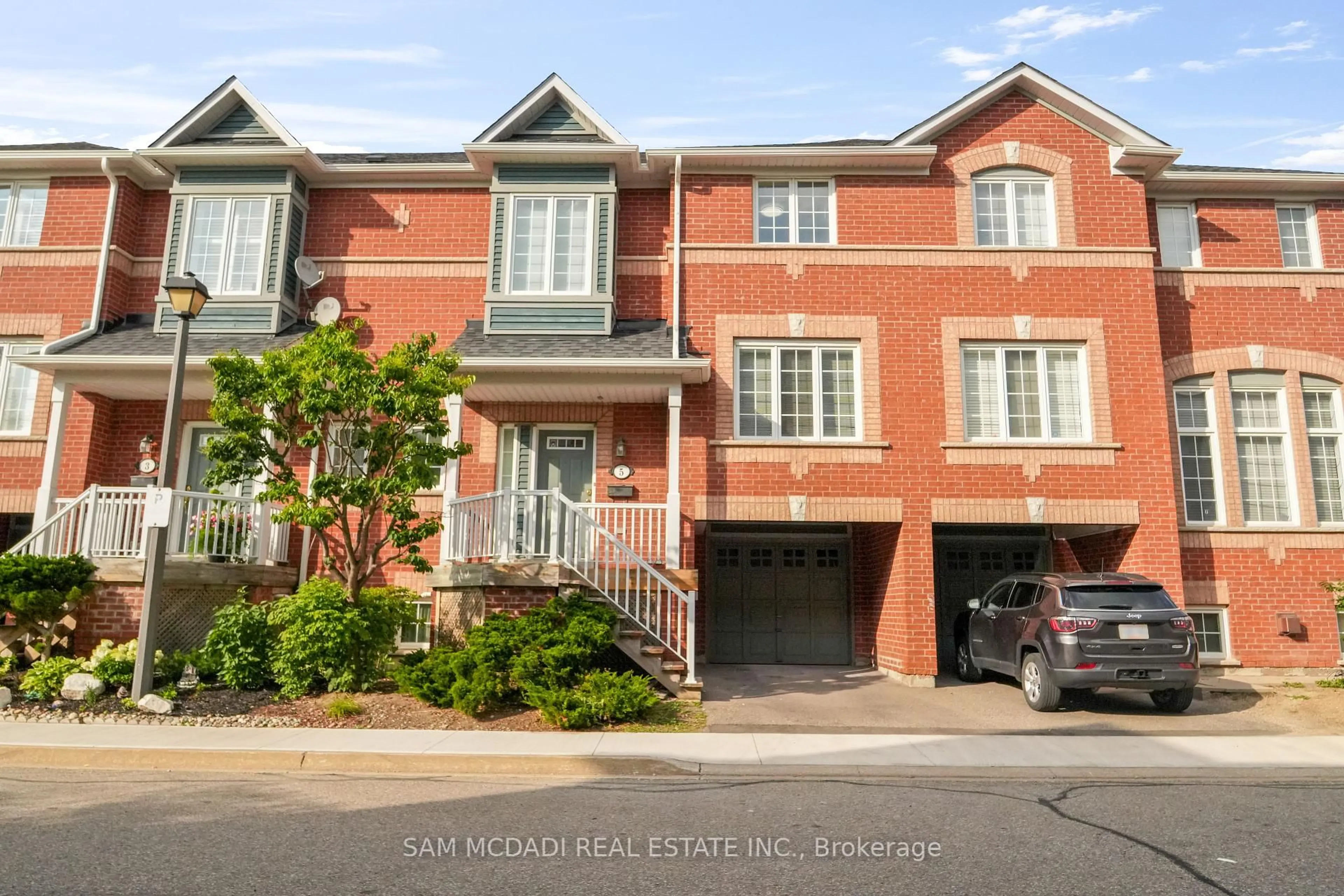 Home with brick exterior material, street for 5031 East Mill Rd #5, Mississauga Ontario L5V 2M5