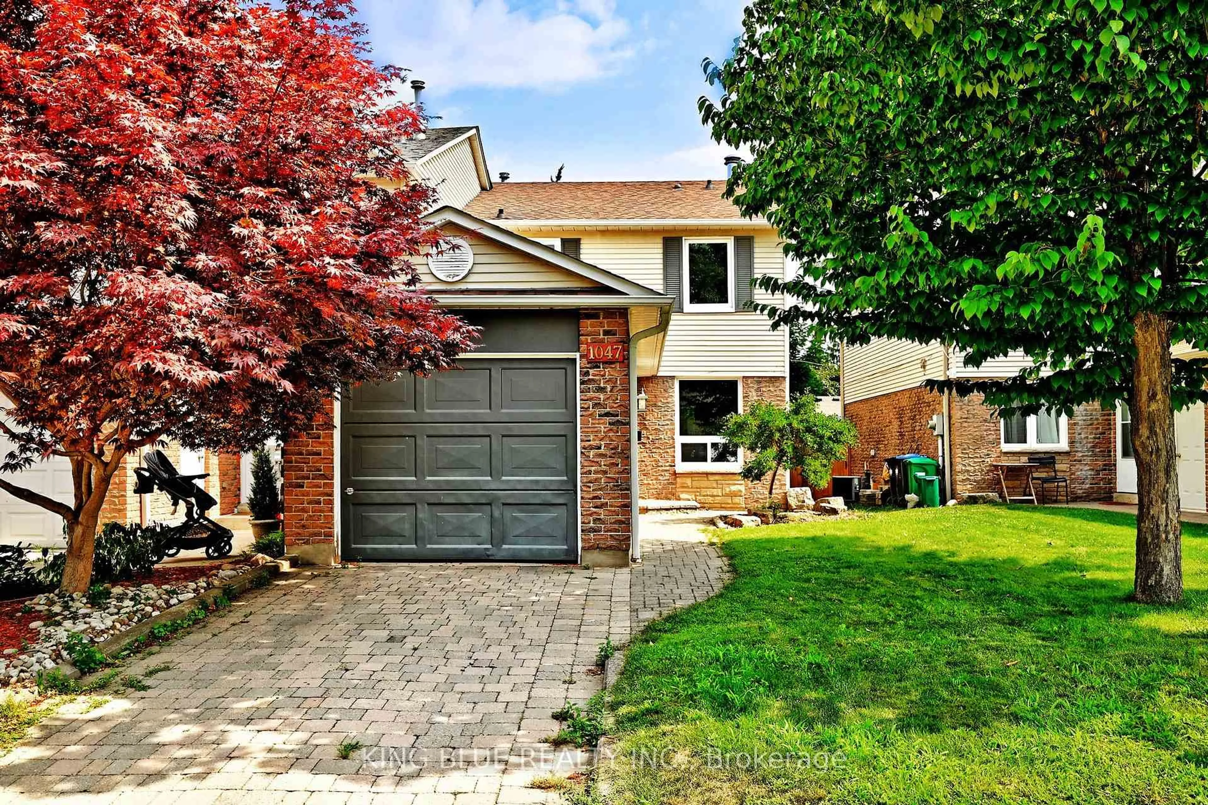Home with brick exterior material, street for 1047 Raintree Lane, Mississauga Ontario L5H 4A1