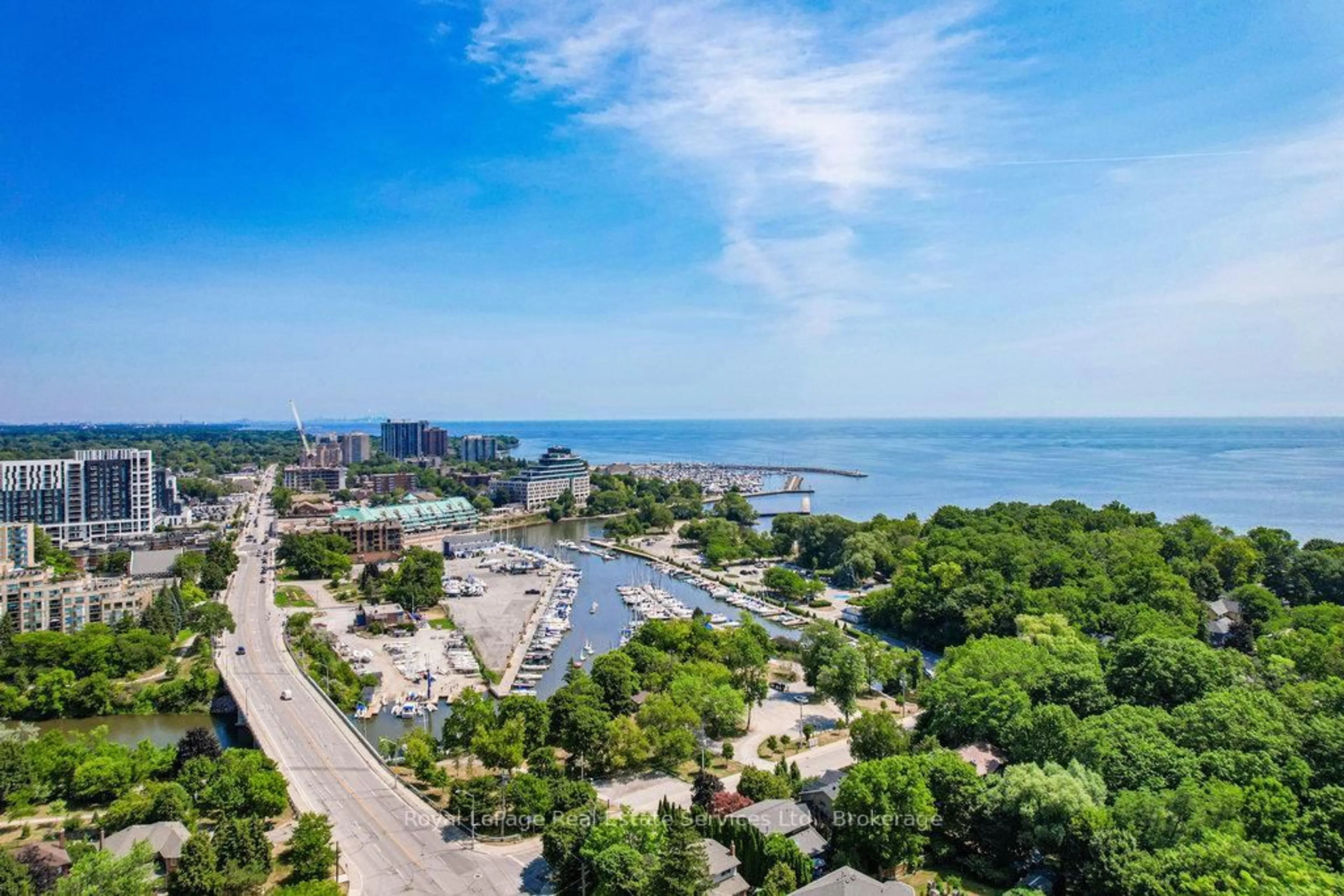 A pic from outside/outdoor area/front of a property/back of a property/a pic from drone, water/lake/river/ocean view for 3039 Lakeshore Rd, Oakville Ontario L6L 1J1