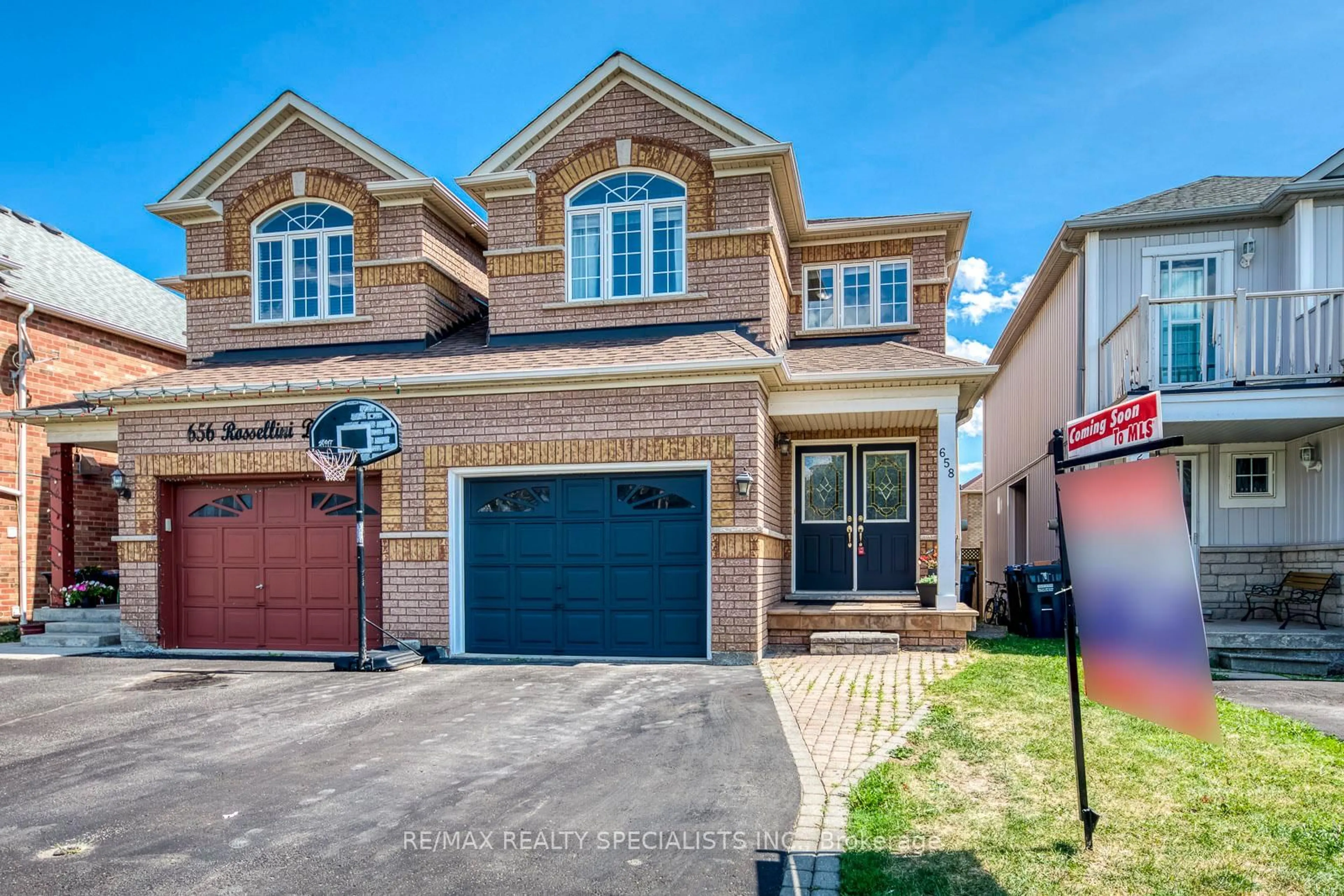 Home with brick exterior material, street for 658 Rossellini Dr, Mississauga Ontario L5W 1K9