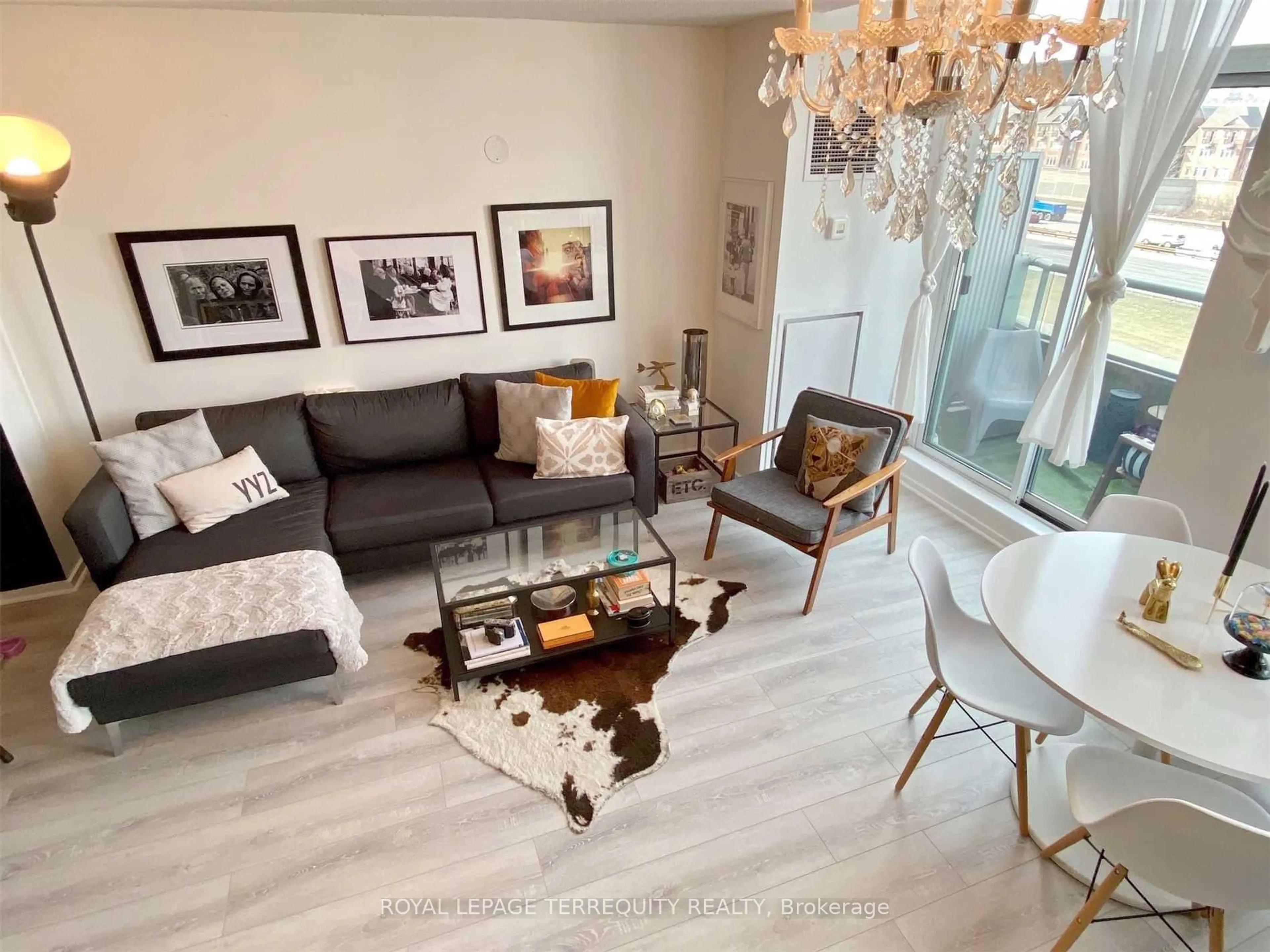 Living room with furniture, wood/laminate floor for 200 Manitoba St #328, Toronto Ontario M8Y 3Y9
