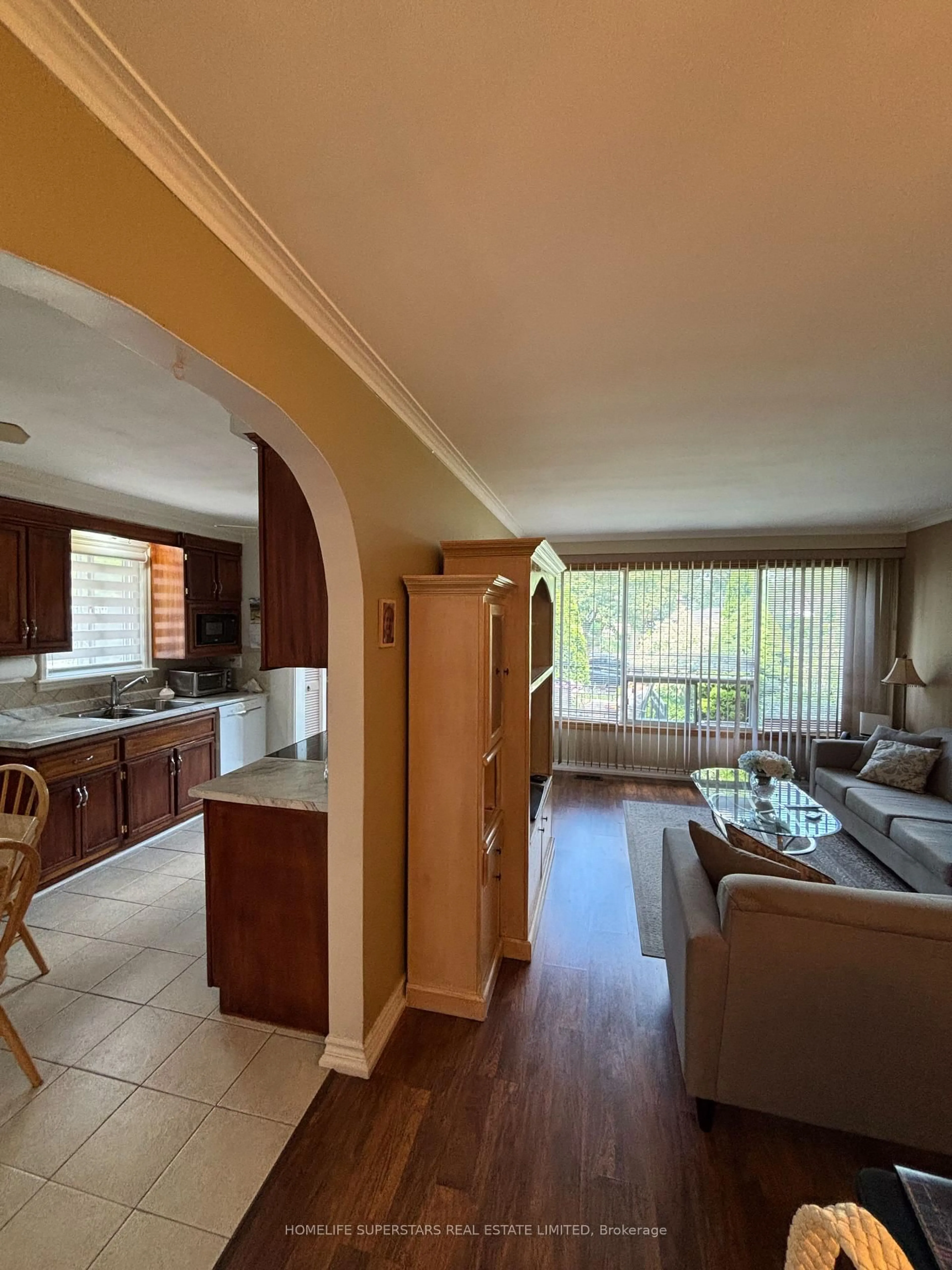 Living room with furniture, wood/laminate floor for 69 Thistle Down Blvd, Toronto Ontario M9V 1J1