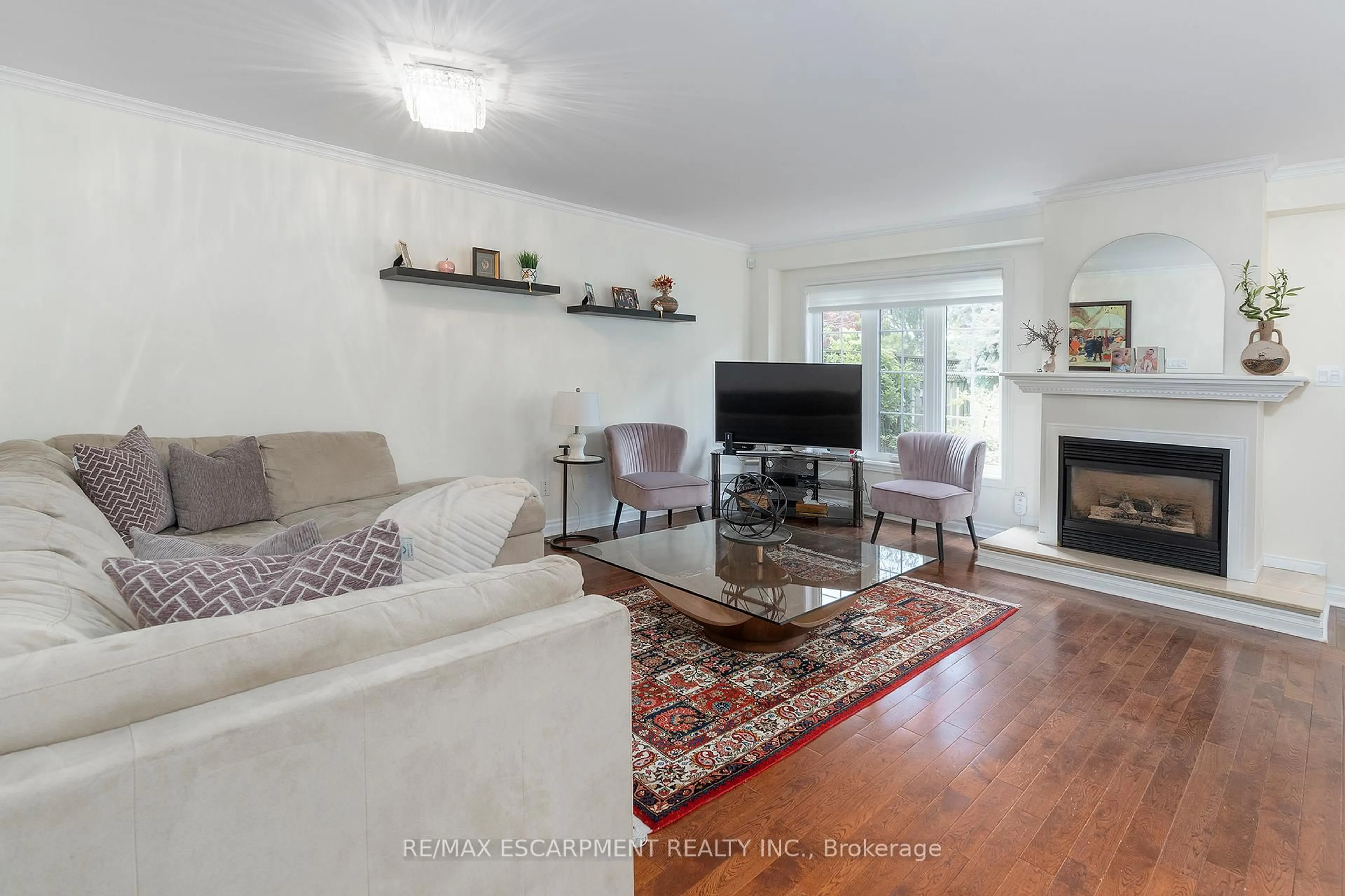 Living room with furniture, wood/laminate floor for 3333 New St #74, Burlington Ontario L7N 1N1