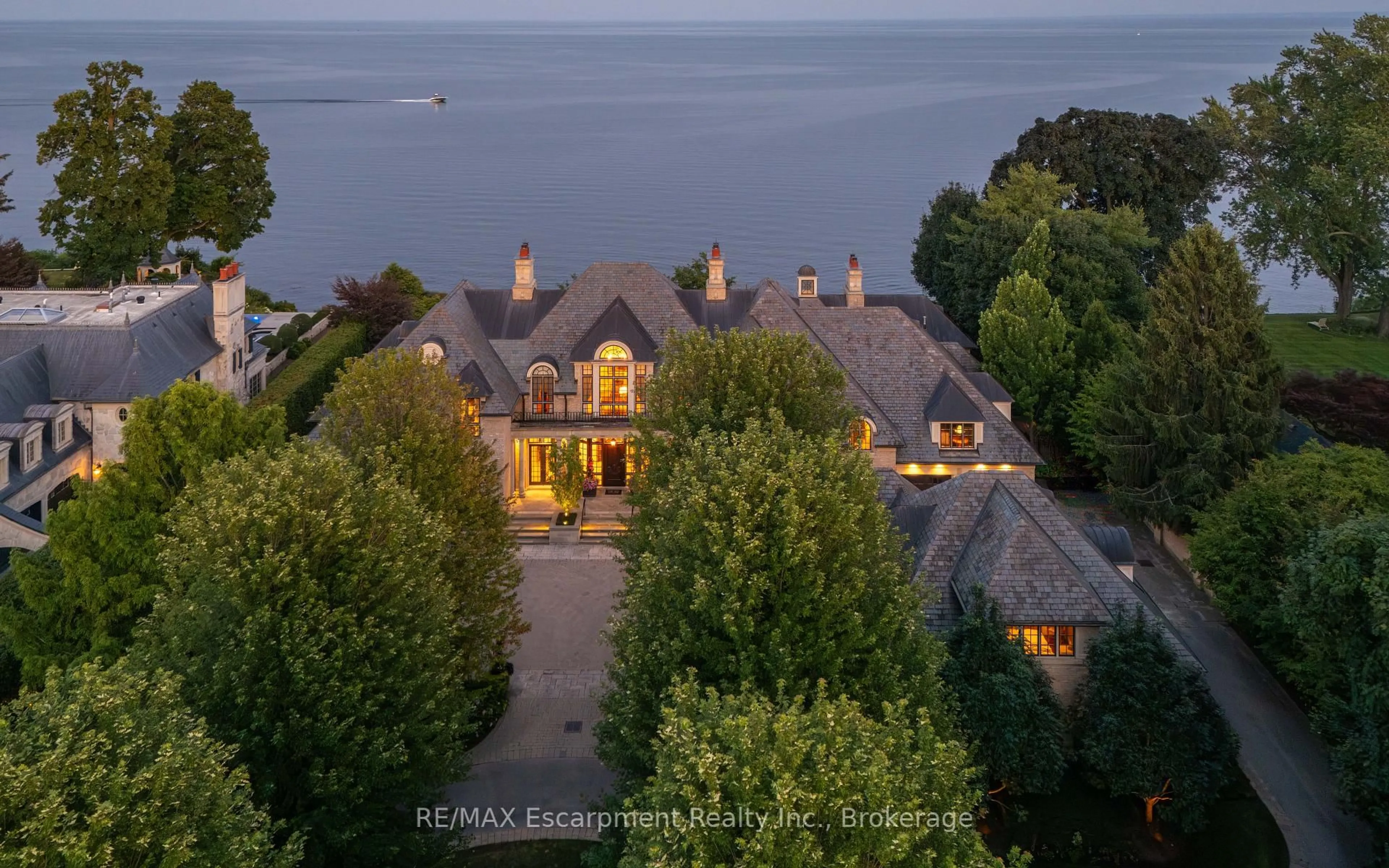 A pic from outside/outdoor area/front of a property/back of a property/a pic from drone, water/lake/river/ocean view for 2054 Lakeshore Rd, Oakville Ontario L6J 1M3