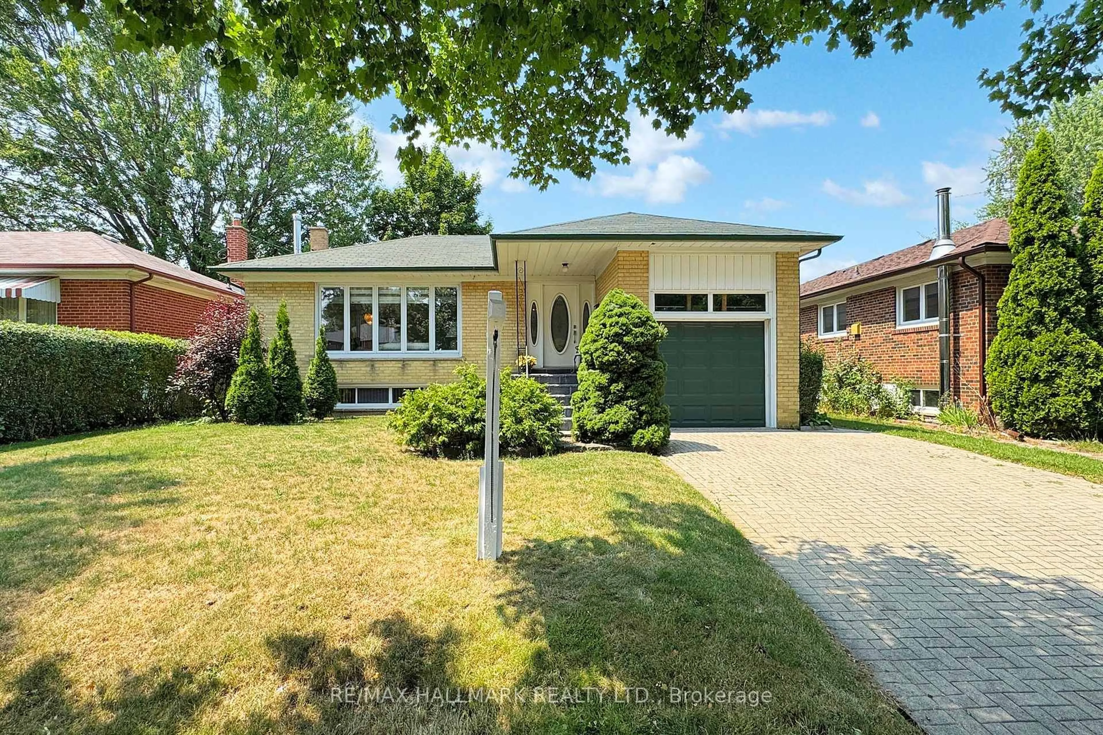 Home with brick exterior material, street for 69 Breadner Dr, Toronto Ontario M9R 3M5