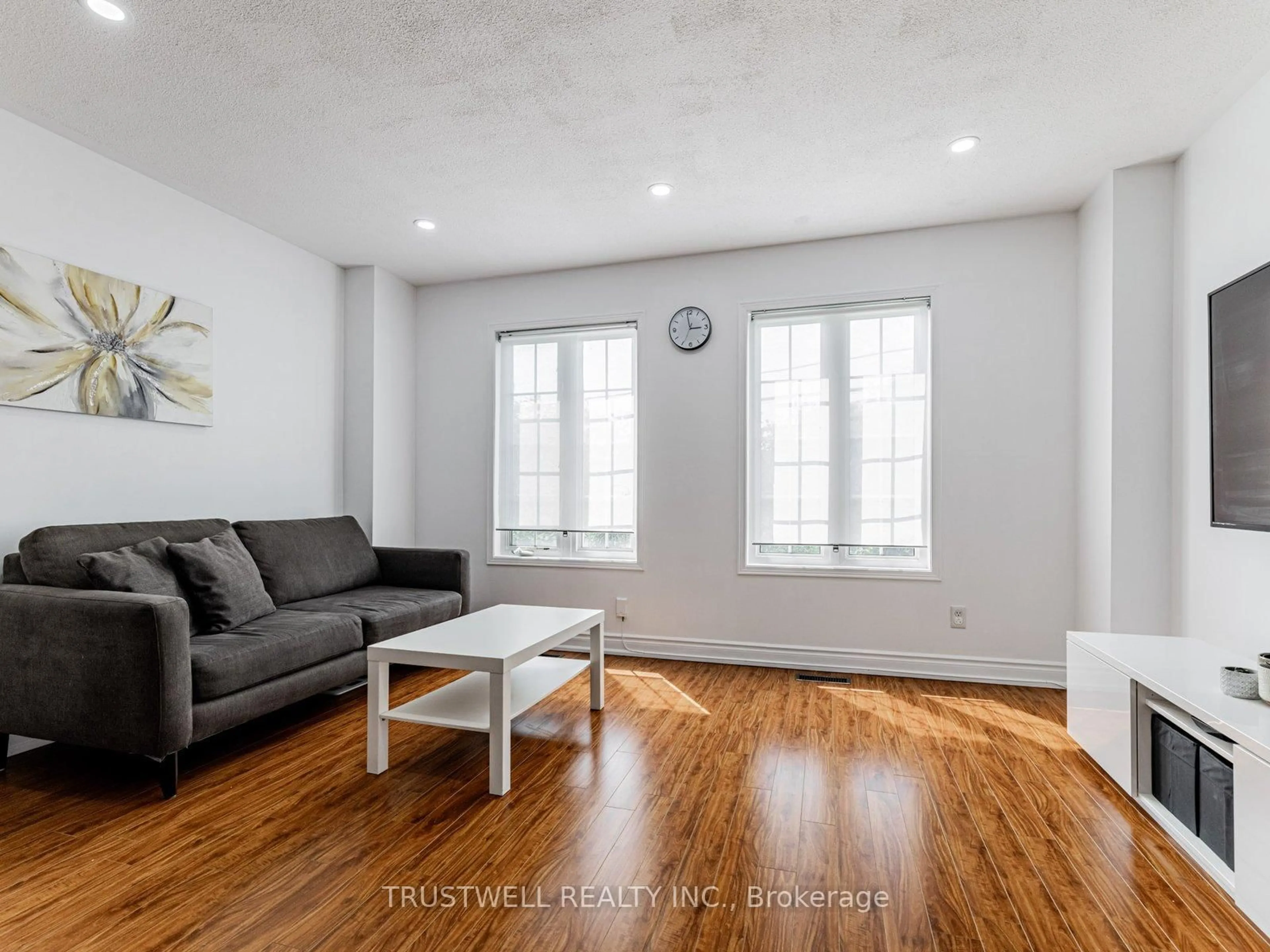 Living room with furniture, wood/laminate floor for 127 Torbarrie Rd, Toronto Ontario M3L 1G8