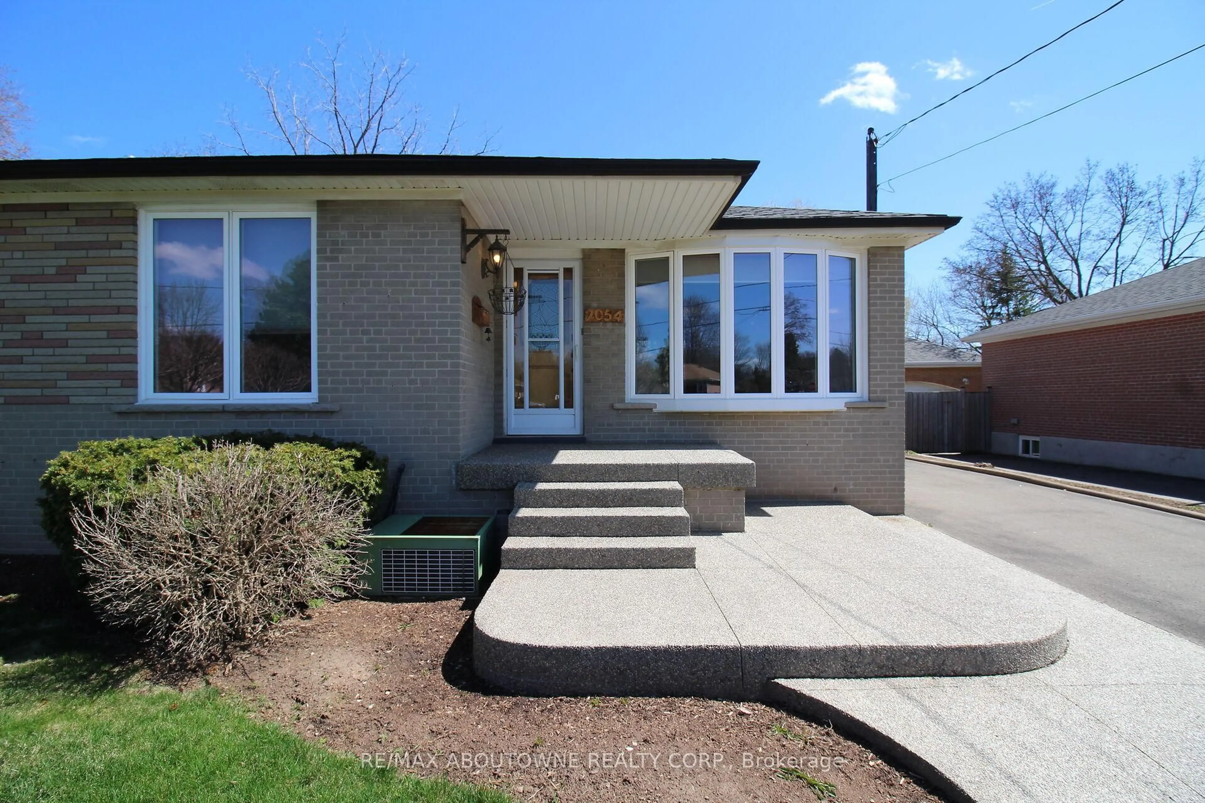 Home with brick exterior material, street for 2054 Bridge Rd, Oakville Ontario L6L 2E7