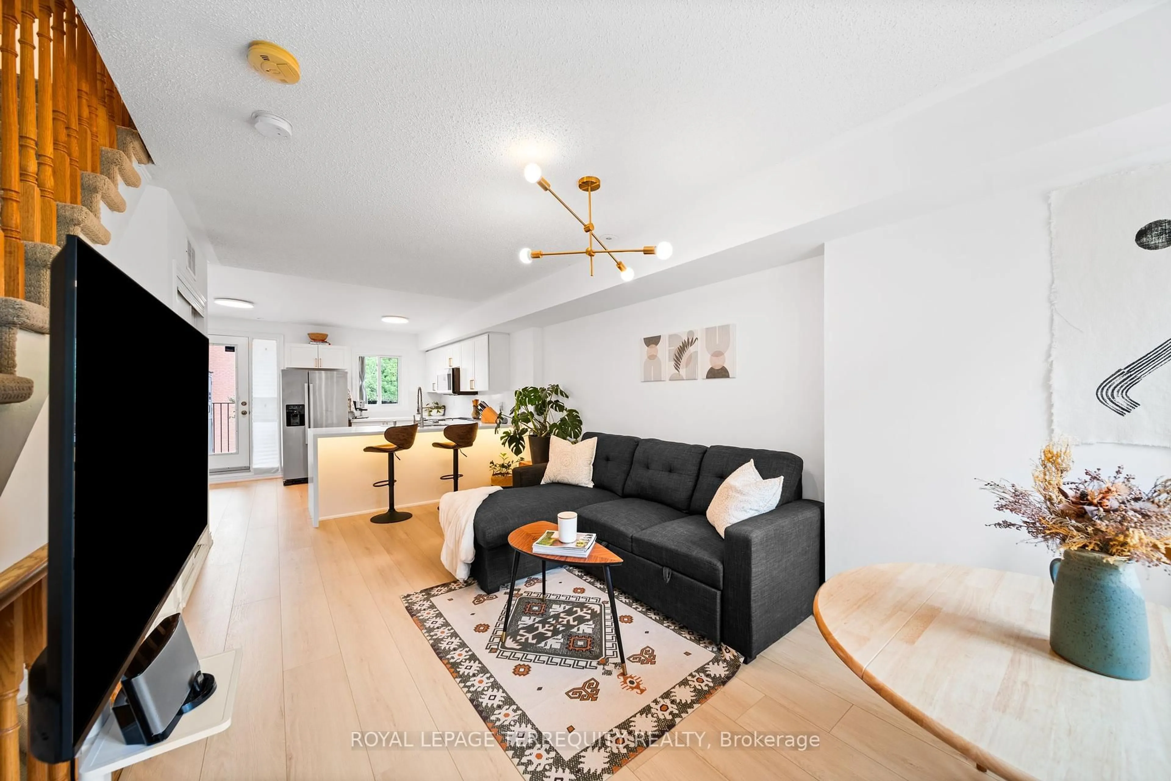Living room with furniture, wood/laminate floor for 236 Wiltshire Ave, Toronto Ontario M6N 5G2