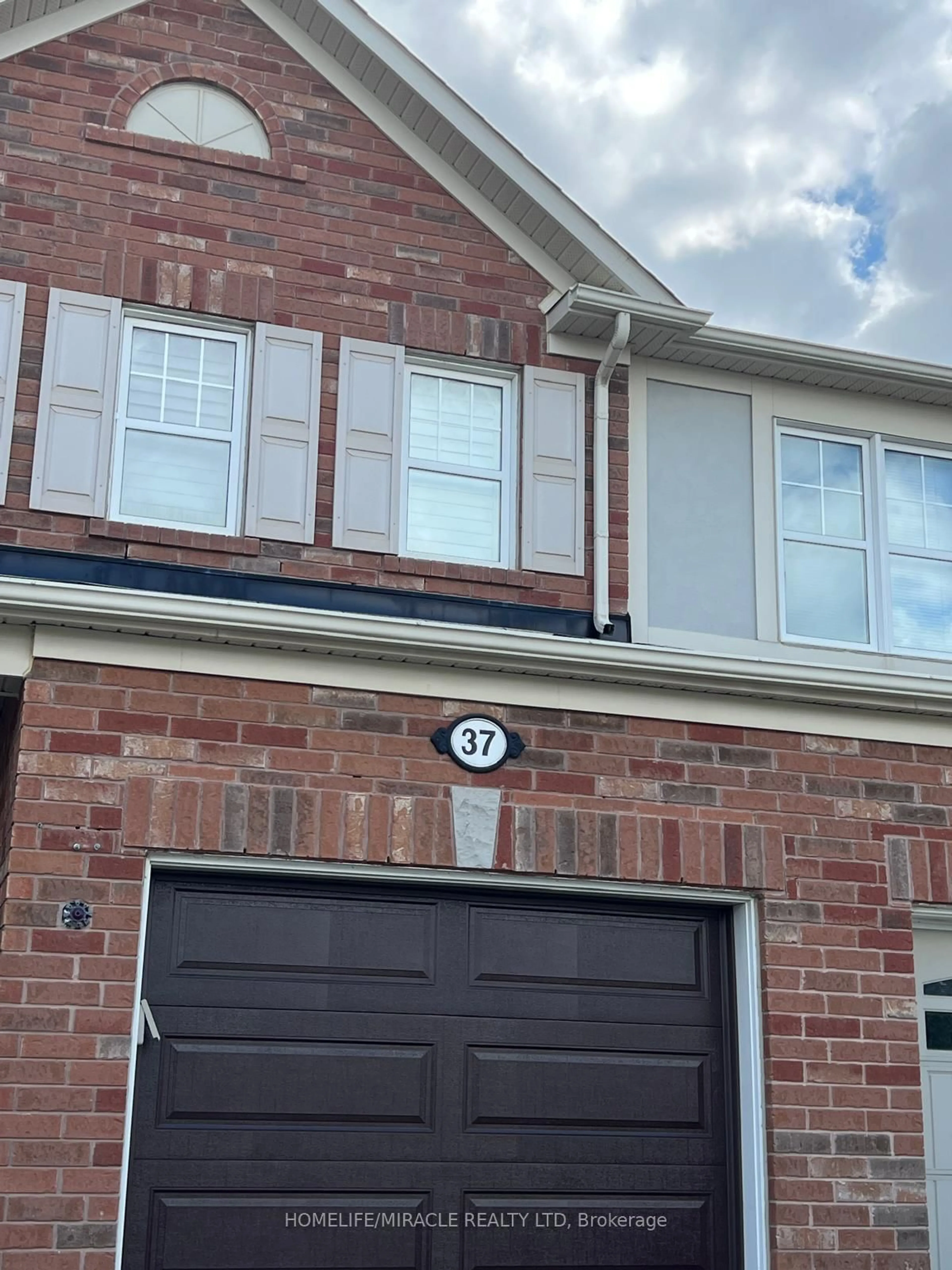 Home with brick exterior material, street for 37 Caliper Rd, Brampton Ontario L6P 3R2